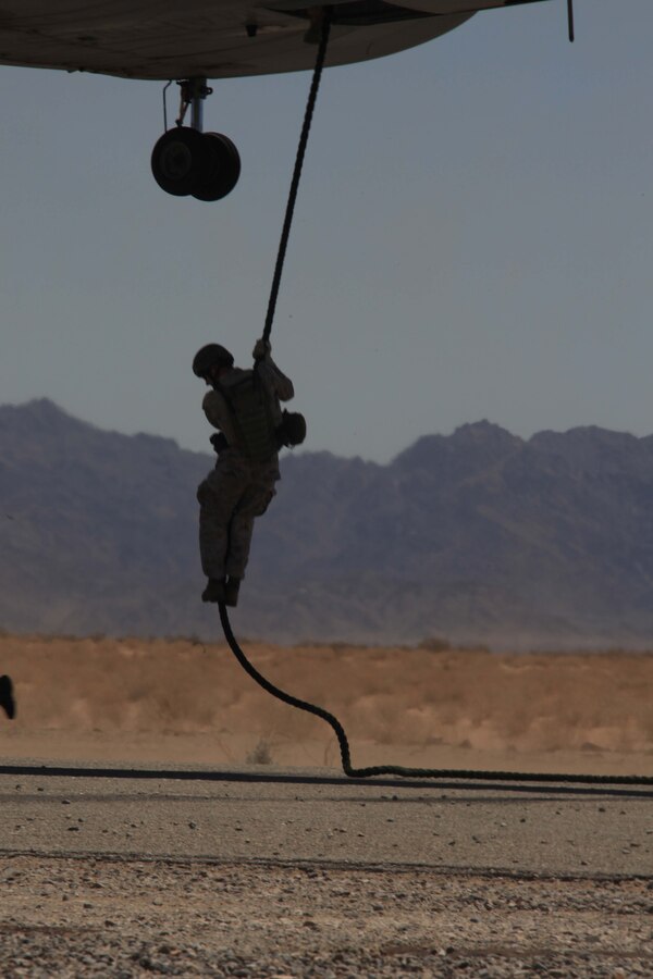 A 3rd Reconnaissance Company Marine fast-ropes out of a CH-46 as part of a tactical insertion exercise at Marine Corps Air Station Yuma, Ariz., July 20, 2011. The exercise was part of Operation Javelin Thrust 2011, which is the largest reserve training exercise in the Marine Corps.