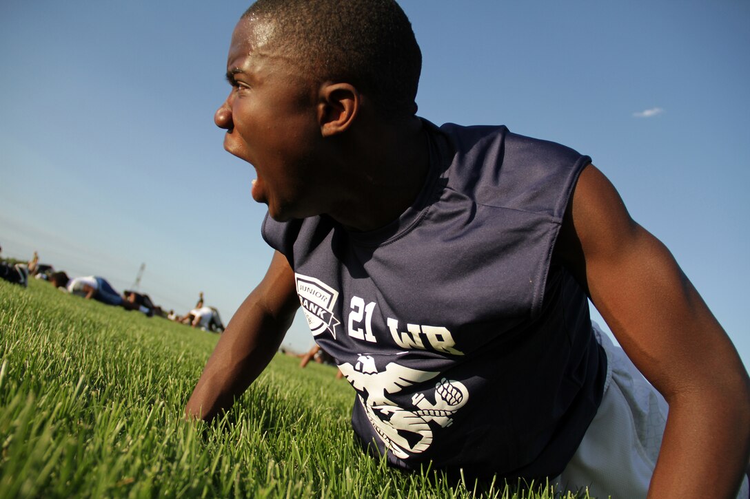 An athlete demonstrates his motivation during the Minneapolis Junior Rank Diamond Flight Football Camp at Maple Grove Senior High School July 21. To find out when Junior Rank and the Marines will be in your area, visit www.juniorrank.com. Additional imagery from the Minneapolis Junior Rank Camp can also be found at www.facebook.com/rstwincities.