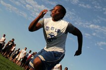 An athlete attending the Minneapolis Junior Rank Diamond Flight Football Camp conducts warm-up exercises at Maple Grove Senior High School July 21. Junior Rank was founded in 2008 by Shaon Berry, a youth football coach and former University of Pittsburgh running back. For additional imagery from the event, visit www.facebook.com/rstwincities.