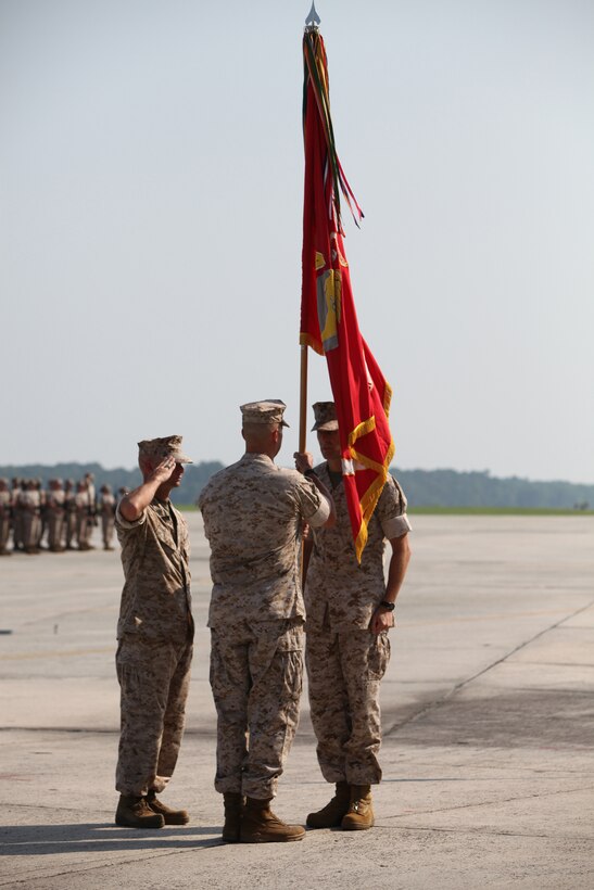 Colonel Michael Cederholm, the Marine Aircraft Group 31 commanding officer, and Col. David Robinson, the outgoing MAG-31 commanding officer, recieves the Marine Corps colors in front of the Marines from the multiple Marine Corps F/A-18 squadrons July 22, aboard Fightertown.  Cederholm takes control of a full house with all of the squadrons currently in garrison, which is a rare occurrence with the rapid training and deployment schedule.