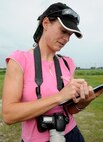 KUNSAN AIR BASE, Republic of Korea -- Francesca Zino, an Environmental Resources Management consultant and United Kingdom native, takes down notes during a migratory avian survey being held here July 21. (U.S. Air Force photo/Staff Sgt. Rasheen A. Douglas)