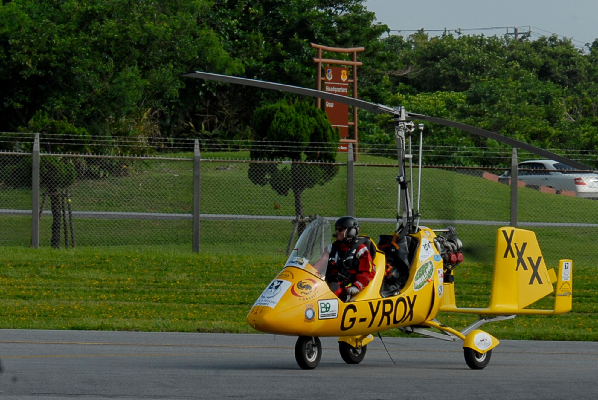 Norman Surplus, an autogyro pilot from Larne, County Antrim, Northern Ireland, taxis down Kadena's runway July 20 in his MT-03 autogyro, 'Roxy'. Surplus is making the first world record attempt at an autogryo circumnavigation of the globe in 'Roxy'. His trip will take him across 26 countries, flying over 27,000 miles, or 43,000 kilometers, and crossing deserts, mountains and oceans. (U.S. Air Force photo/ Airman 1st Class Tara A. Williamson)