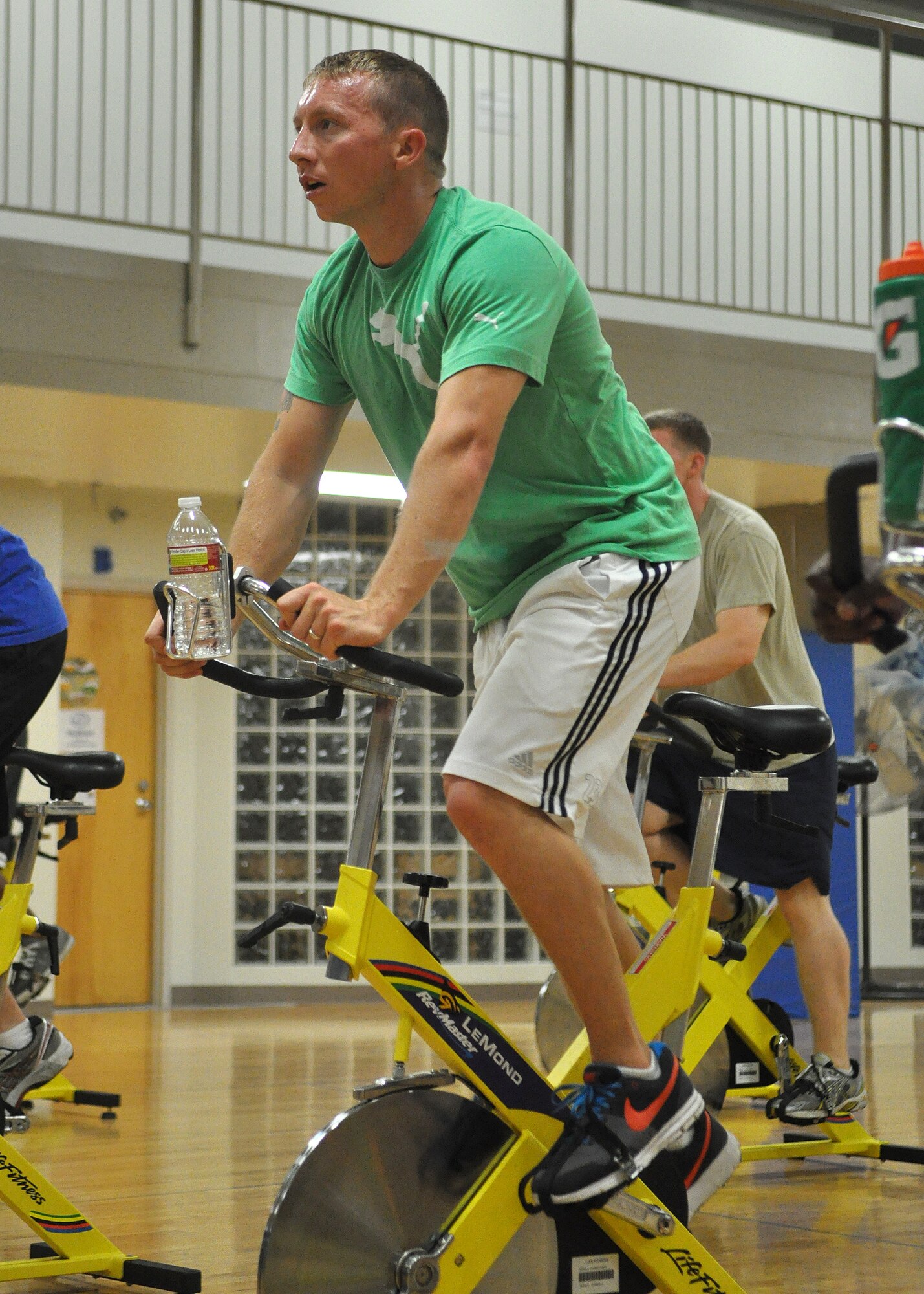 Staff Sgt. Mark Robertson, 62nd Aerial Port Squadron Rodeo Team member, attends a morning cardio spin class July 19 at Joint Base Lewis-McChord, Wash. The APS Rodeo Team has been physically training for the competition since May. Rodeo, sponsored by the Air Mobility Command, is the Mobility Air Force's readiness competition. This competition focuses on improving worldwide air mobility forces' professional core abilities. (U.S. Air Force photo/Airman 1st Class Leah Young)