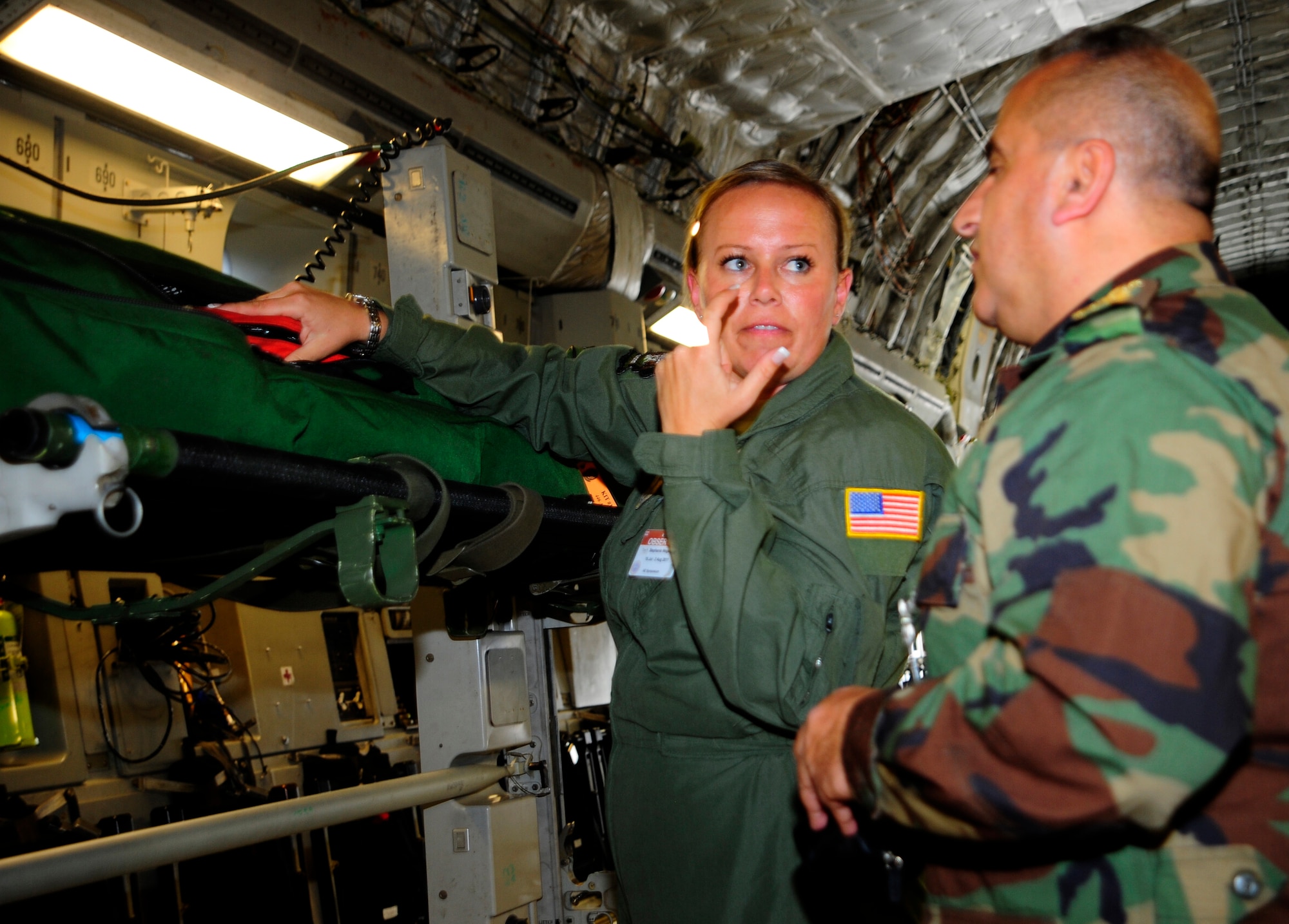 Tech. Sgt. Stephanie Wedgehoft shows Col. Garabed Jeokojian from Lebanon emergency medical equipment she uses as an aeromedical evacuation specialist aboard a C-17 Globemaster III July 20, 2011 at Joint Base Lewis-McChord, Wash. The colonel was there as part of the International Aeromedical Evacuation/En Route Medical Care Conference, the first-ever, U.S.-led event of its kind. Wedgehoft is part of the 446th Aeromedical Evacuation Squadron. (U.S. Air Force photo/Staff Sgt. J.G. Buzanowski)