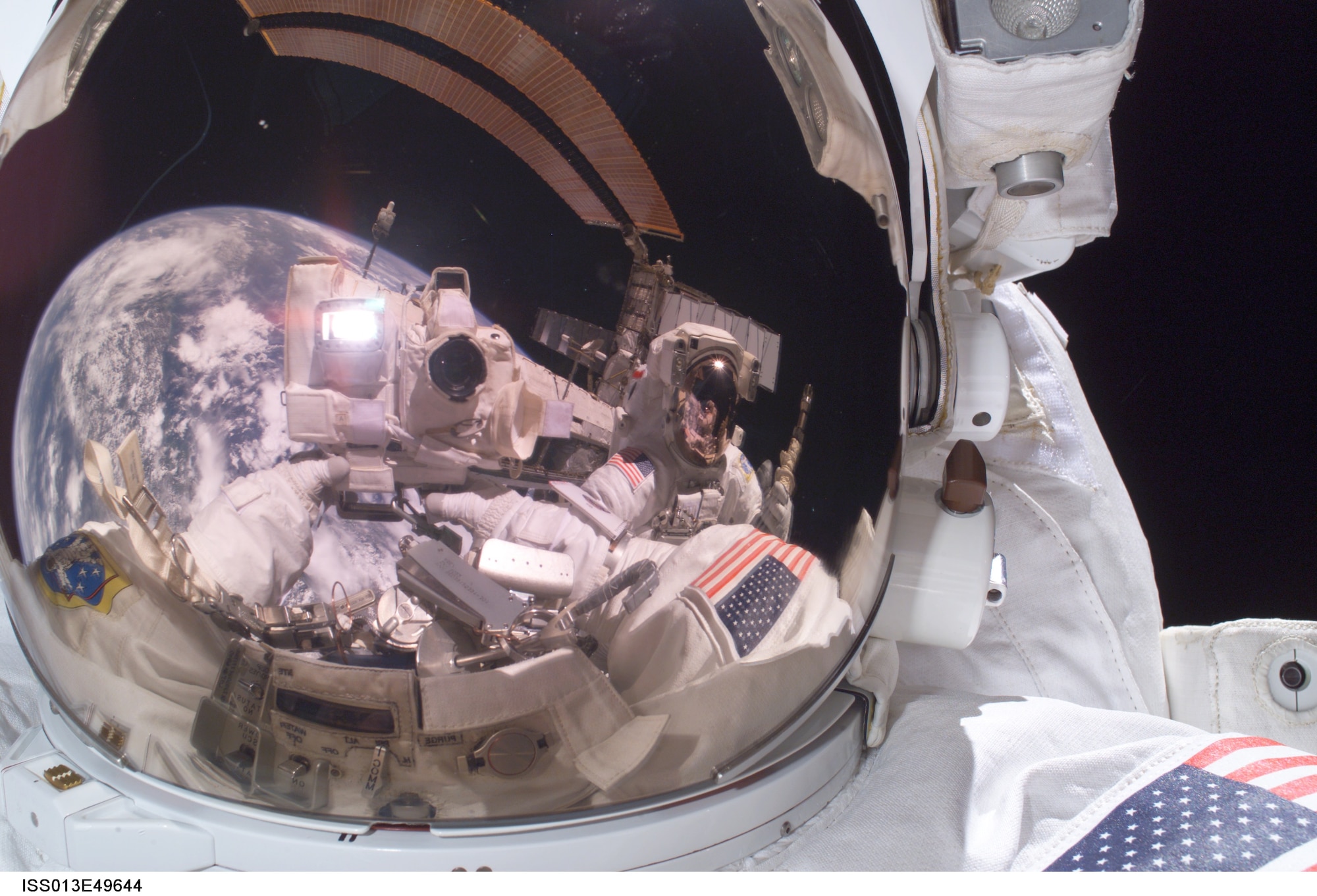 Michael Fossum, Air Force colonel retired, takes a portrait of himself in space
Jan. 21, 2006. Fossum, the father of 1st Lt. Mitchell Fossum of the 90th
Flying Training Squadron, is currently 220 miles about the earth's surface
serving a six-month tour of duty aboard the International Space Station. (U.S. Air Force photo/Mike Fossum)