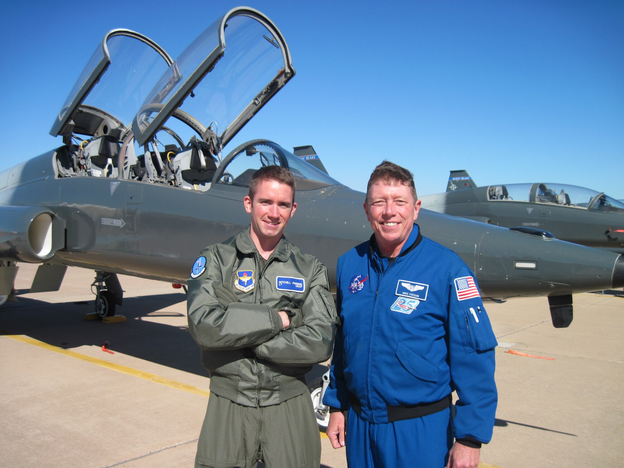 First Lieutenant Mitchell Fossum(left),  T-38 instructor pilot, and his
father Michael Fossum, Air Force colonel retired, pose in front of a Euro-NATO
Joint Jet Pilot Training  Program student trainer T-38, while Lieutenant
Fossum was a student in the ENJJPT program. Fossum, the father of 1st Lt.
Mitchell Fossum of the 90th Flying Training Squadron, is currently 220 miles
about the earth's surface serving a six-month tour of duty aboard the
International Space Station. (U.S. Air Force
courtesy photo)
