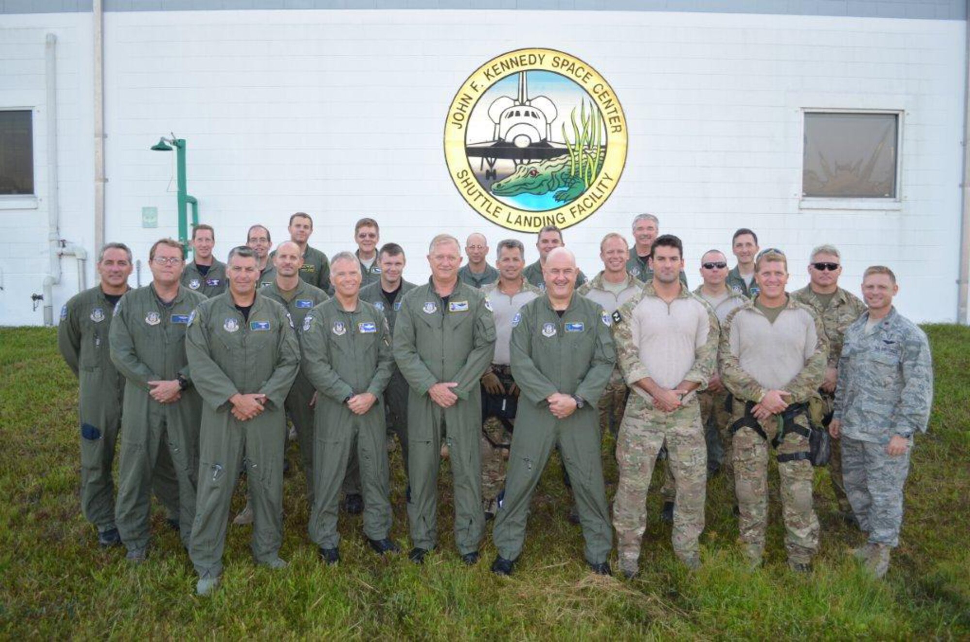 CAPE CANAVERAL, Fla. - Team Rescue, comprising of  Air Force Reservists from the 920th Rescue Wing, stand tall during the final landing of the  Space Shuttle Atlantis,  July 21, 2011. This group of Reserve Airmen are comprised of HH-60G Pave Hawk helicopter pilots, crew, pararescueman and flight medics. These rescue responders have been the insurance policy ready to perform the world's largest search and rescue mission if called upon, during the astronauts' daring entries and exits into space. This is the final flight for the Atlantis marking the end of NASA?s manned space program.  Rescue reservists from the 920th RQW, Patrick Air Force Base, Fla., have been present since the start of the shuttle mission to clear the range and stand by in the event of a mishap. The 920th RQW uses HC-130P/N King refueling aircraft and HH-60G Pave Hawk helicopters to transport their highly-trained and effective rescue teams, often called Guardian Angels. Their unique combat search-and-rescue skills and equipment make them the most qualified in the world to respond to any emergency scenario, the worst being one that would cause the astronauts to bail out over the Atlantic Ocean during liftoff. Even though the shuttle mission has come to an end, the Airmen from the 920th RQW are on hand for every rocket launch to clear the 1,000 square mile area, called the Eastern Range, over the Atlantic Ocean. (U.S Air Force photo/Major Simpson)