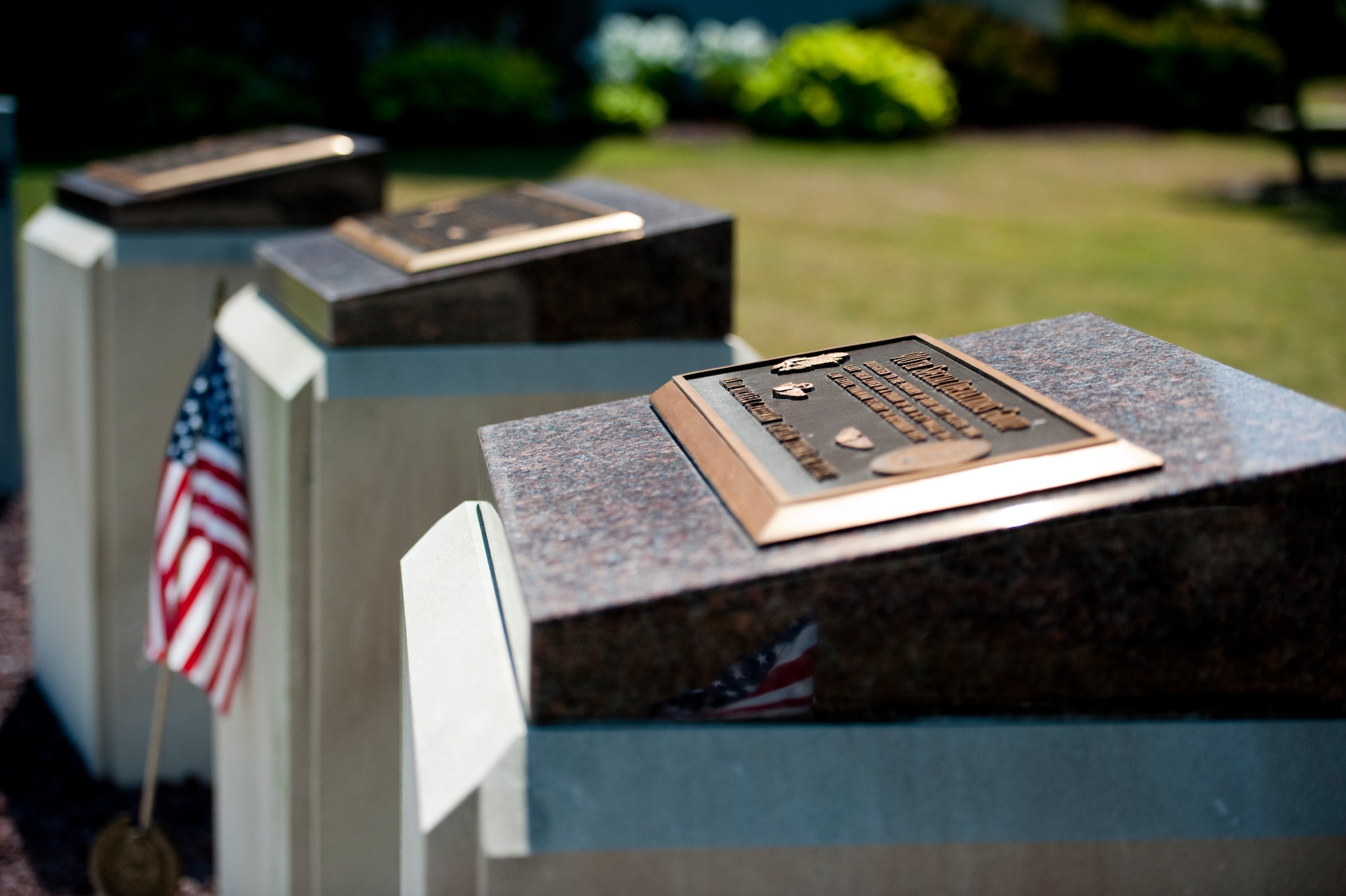 A memorial placard in front of the 910th Airlift Wing's headquarters building, here,  honors Maj. Michael C. Freeman and Capt. Thomas M. Pytel, two unit pilots killed in an A-37 accident. Their aircraft crashed while performing a low-level flying training mission Oct.14, 1972. The memorial sits next to two similar placards honoring other lives lost in unit aircraft accidents.  
