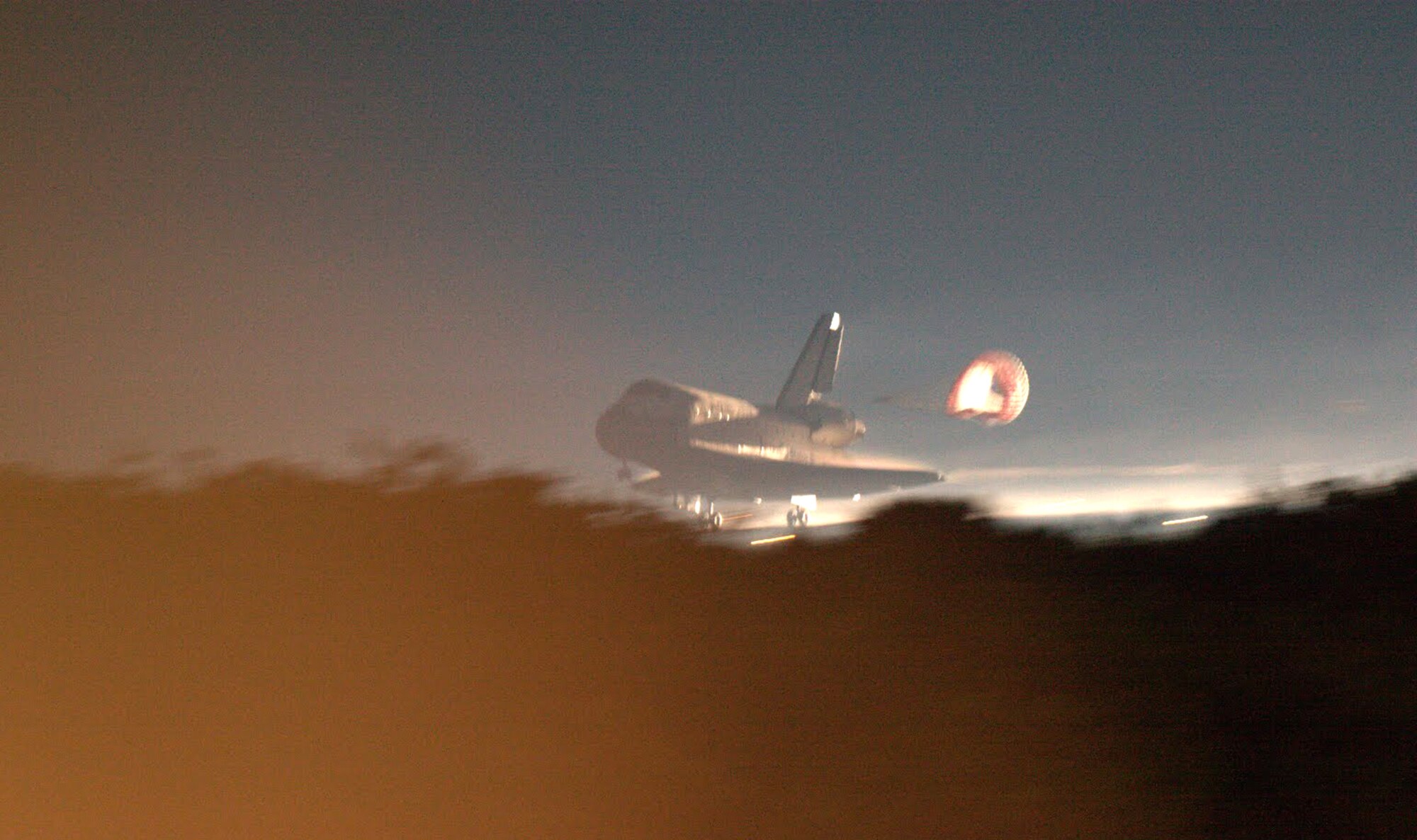 CAPE CANAVERAL, Fla. - The Space Shuttle Atlantis makes its return to Earth,  July 21, 2011. This is the final flight for the Atlantis marking the end of NASA's manned space program.  Rescue reservists from the 920th Rescue Wing, Patrick Air Force Base, Fla., have been present since the start of the shuttle mission to clear the range and stand by in the event of a mishap. The 920th RQW uses HC-130P/N King refueling aircraft and HH-60G Pave Hawk helicopters to transport their highly-trained and effective rescue teams, often called Guardian Angels. Their unique combat search-and-rescue skills and equipment make them the most qualified in the world to respond to any emergency scenario, the worst being one that would cause the astronauts to bail out over the Atlantic Ocean during liftoff. Even though the shuttle mission has come to an end, the Airmen from the 920th RQW are on hand for every rocket launch to clear the 1,000 square mile area, called the Eastern Range, over the Atlantic Ocean. (U.S. Air Force photo/Capt. Ryan Liss)