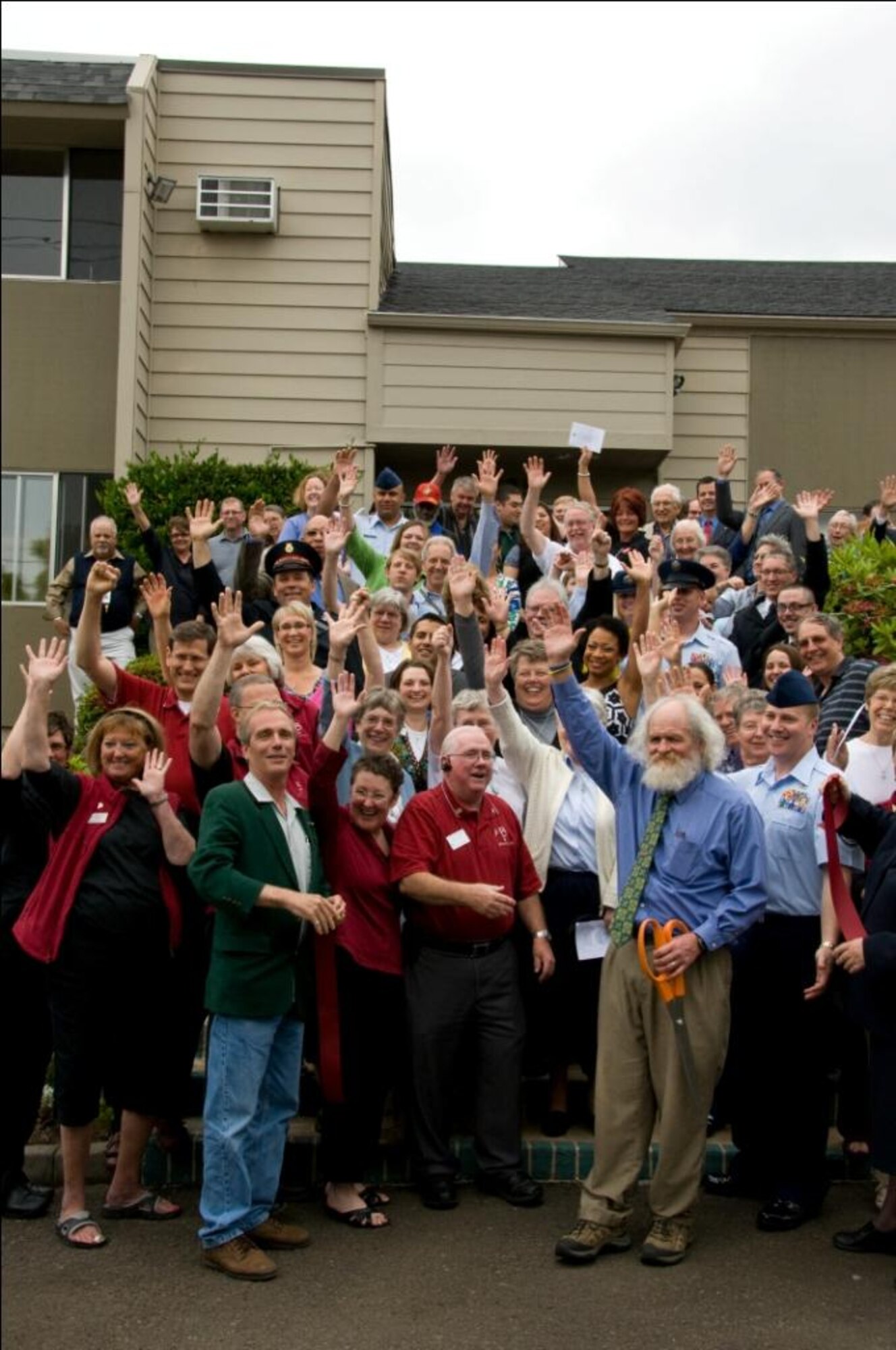 More than 350 people turned out for a veteran’s homeless shelter official ribbon-cutting ceremony June 22 in Beaverton, Ore. Several members of the 361st Recruiting Squadron who were instrumental in ensuring the veteran’s homeless shelter was complete and ready for veterans and their families attended the ceremony.(U.S. Air Force photo/courtesy photo)