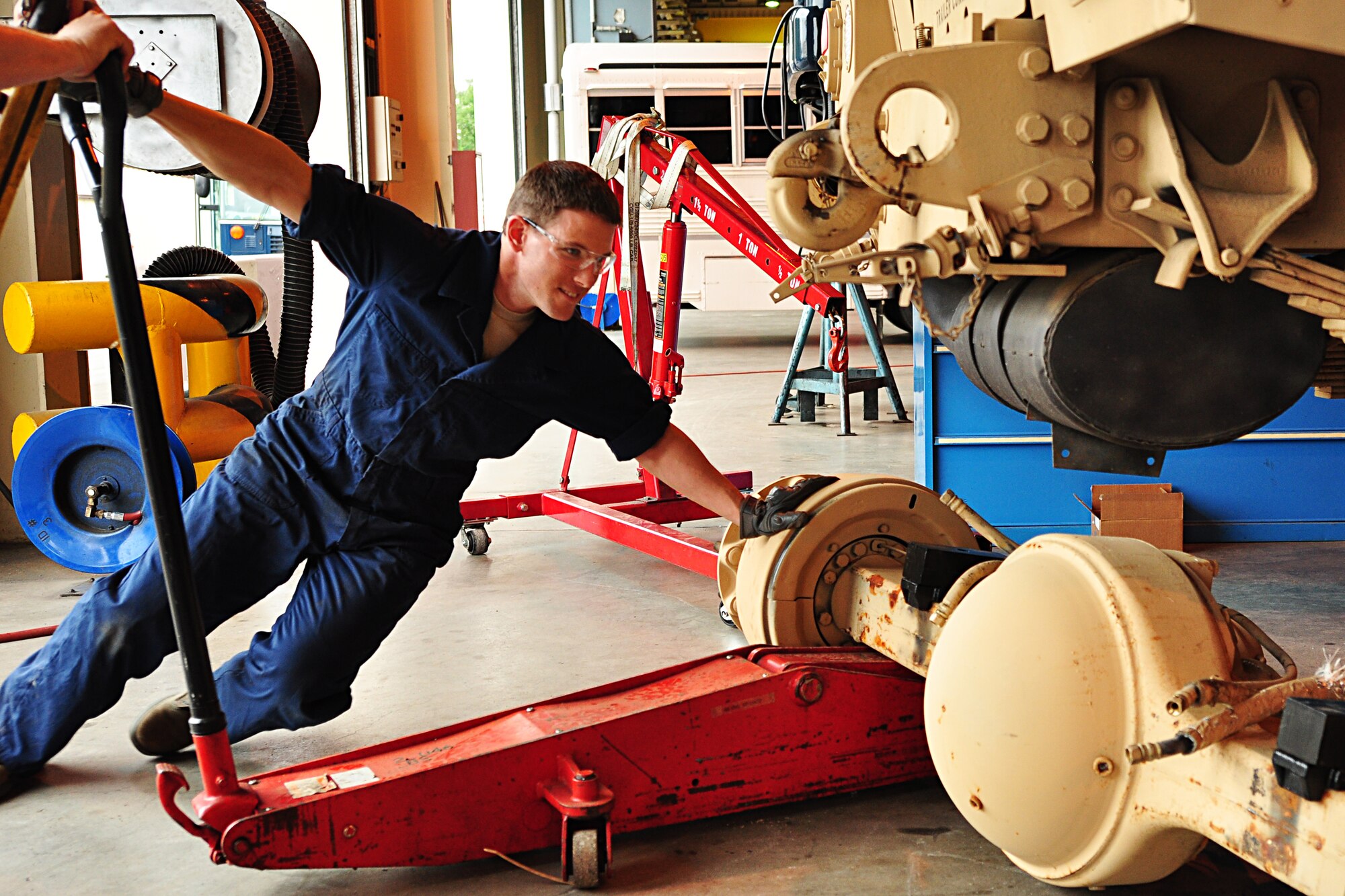 WRIGHT-PATTERSON AIR FORCE BASE, Ohio - Staff Sgt. Curtis Jones, 445th Logistics Readiness Squadron vehicle equipment maintenance journeyman, works on a mine-resistant ambush protected vehicle during the unit's annual tour to Ramstein Air Base, Germany, June 11-25. (U.S. Air Force photo/Senior Airman Mikhail Berlin)