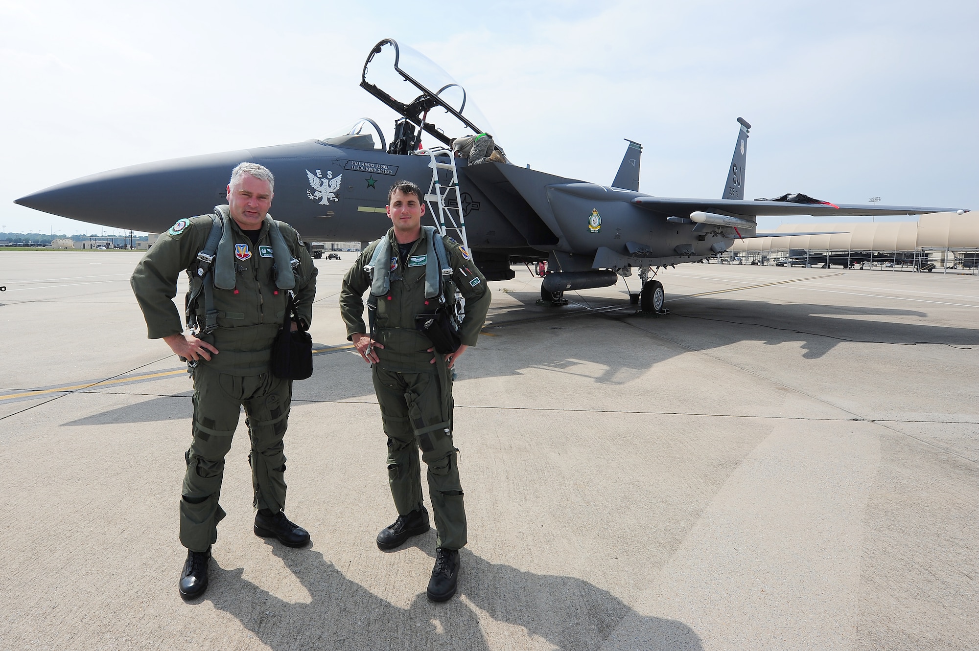 SEYMOUR JOHNSON AIR FORCE BASE, N.C. - Lt. Col. David Moeller and Capt. Joseph Stenger pose in front of the 335th Flagship F-15E Strike Eagle after its maiden flight with heritage patches here July 19, 2011. Air Combat Command officials approved the patches to be displayed until May 2012. Moeller, 335th FS commander, hails from Moreno Valley, Calif., and Stenger, 335th FS pilot, is a native of Barnsville, Ohio. (U.S. Air Force photo by Senior Airman Rae Perry/RELEASED)