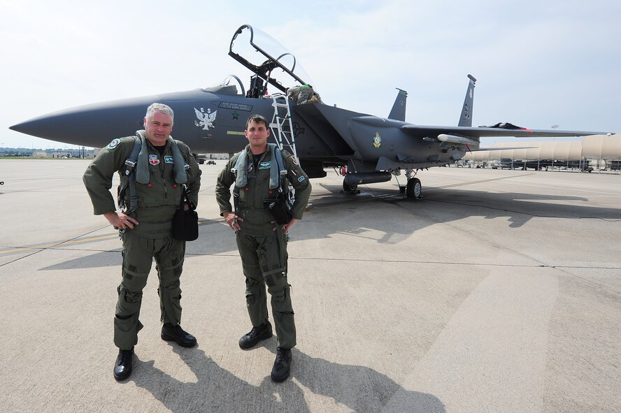 SEYMOUR JOHNSON AIR FORCE BASE, N.C. - Lt. Col. David Moeller and Capt. Joseph Stenger pose in front of the 335th Flagship F-15E Strike Eagle after its maiden flight with heritage patches here July 19, 2011. Air Combat Command officials approved the patches to be displayed until May 2012. Moeller, 335th FS commander, hails from Moreno Valley, Calif., and Stenger, 335th FS pilot, is a native of Barnsville, Ohio. (U.S. Air Force photo by Senior Airman Rae Perry/RELEASED)