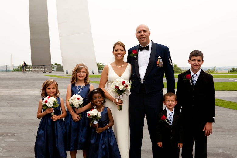 Master Sgt. Christopher Sweet and Danielle Balmer  pose for pictures with their new family July 4th at the Air Force Memorial in Washington, D.C. (Photo courtesy of Hans and Nicole Photography)


