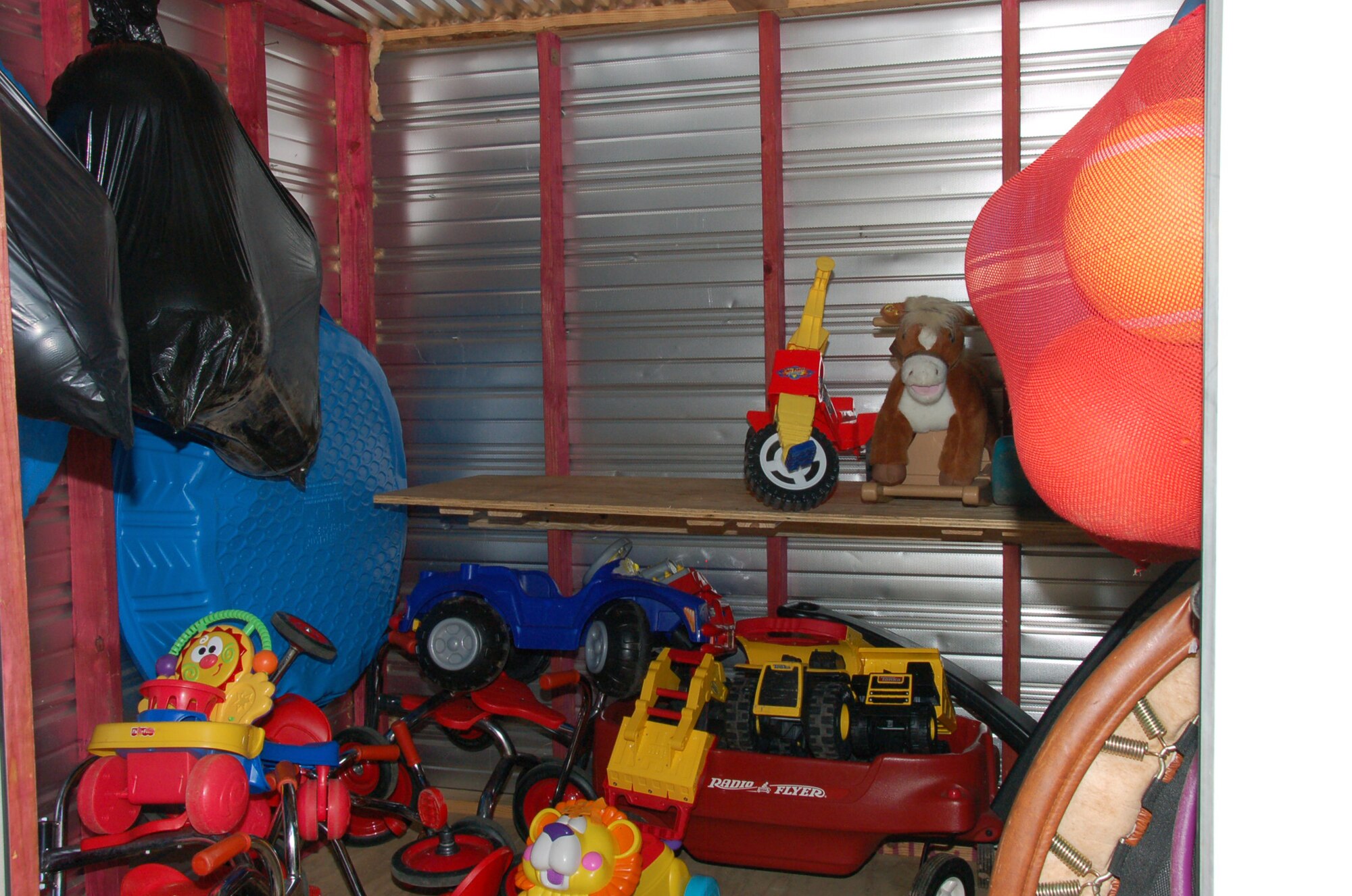 SHREVEPORT, La. – Fourteen members of the Eighth Air Force built shelves in the Providence House daycare storage area to give the children more room for their toys July 20. The members were from the Headquarters Eighth Air Force staff and 608th Air Operations Center. The Airmen built new shelves for the daycare and moved furniture in the warehouse. The Providence House, located in downtown Shreveport, La., is a residential development center for homeless families with children, providing comprehensive support services for improving the family structure and moving the family into independent living. (U.S. Air Force photo by Staff Sgt. Brian Stives)