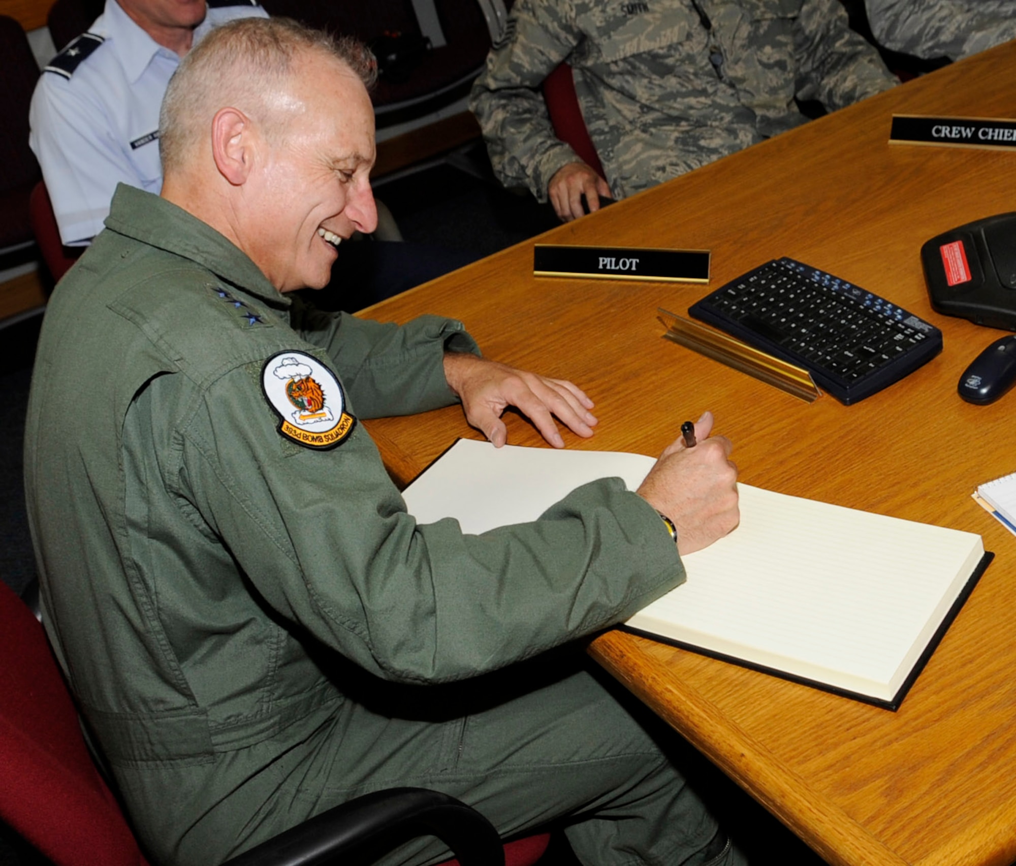 WHITEMAN AIR FORCE BASE, Mo. - Lt. Gen. James M. Kowalski, Air Force Global Strike Command commander, signs the orientation flight log book after his orientation flight in a 509th Bomb Wing B-2 Spirit here July 18. Every person who has ever flown in the B-2 is assigned a "Spirit Number," a tradition started with the aircraft's test flights in 1989. General Kowalski is Spirit #509. (U.S. Air Force photo by Senior Airman Alexandra M. Boutte) (RELEASED)