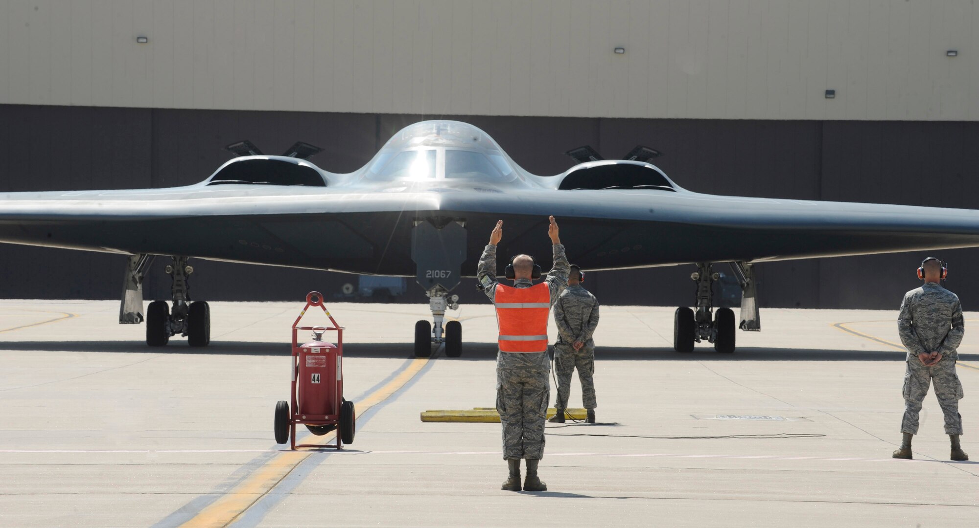 WHITEMAN AIR FORCE BASE, Mo. - Airmen from the 509th Aircraft Maintenance Squadron here assist in the taxi of a B-2 Spirit following an orientation flight for Lt. Gen. James M. Kowalski, Air Force Global Strike Command commander.  The general became the 509th person ever to fly in the B-2. (U.S. Air Force photo by Senior Airman Alexandra M. Boutte) (RELEASED)
