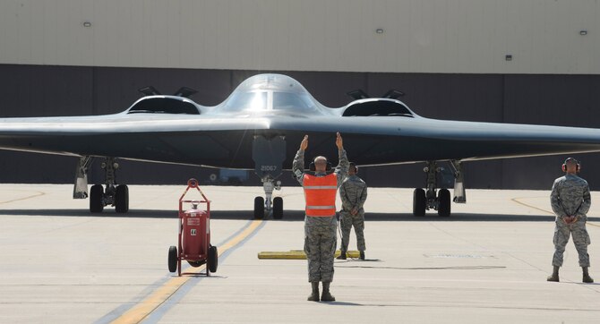 WHITEMAN AIR FORCE BASE, Mo. - Airmen from the 509th Aircraft Maintenance Squadron here assist in the taxi of a B-2 Spirit following an orientation flight for Lt. Gen. James M. Kowalski, Air Force Global Strike Command commander.  The general became the 509th person ever to fly in the B-2. (U.S. Air Force photo by Senior Airman Alexandra M. Boutte) (RELEASED)