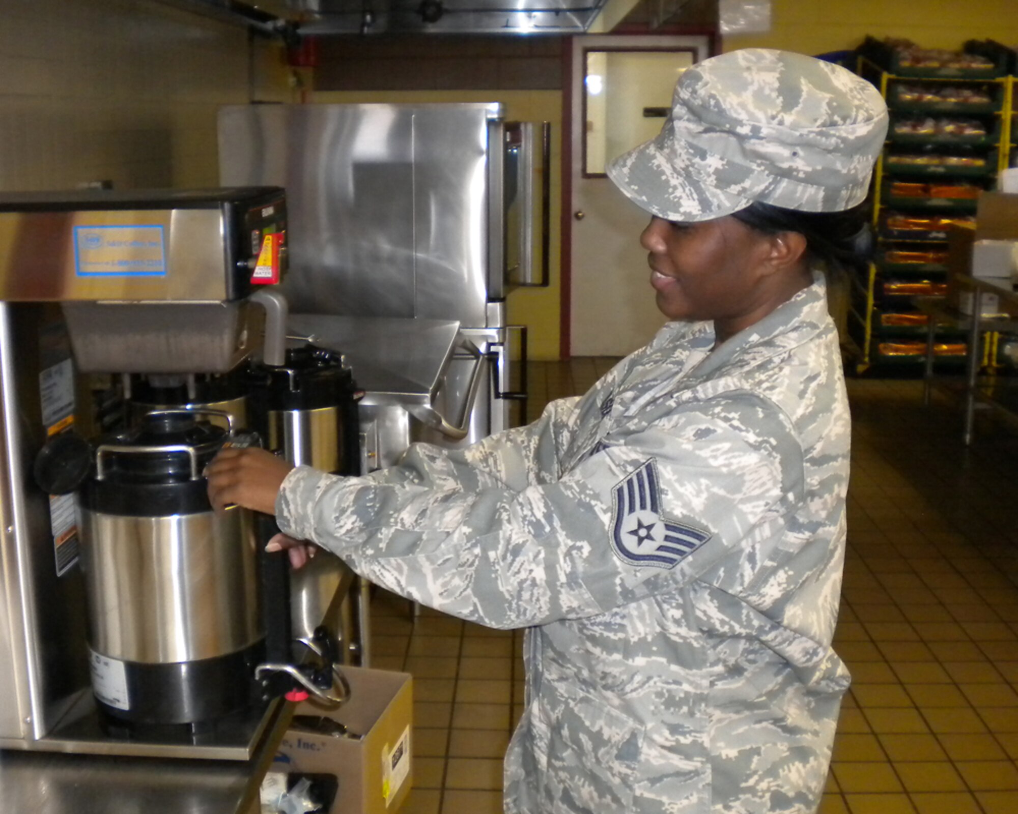 Staff Sgt. Jessica Wilson, a services specialist with the 307th Force Support Squadron from Barksdale Air Force Base, La., prepares coffee for a meal June 22, 2011 at Travis Air Force Base, Calif.  Wilson was part of a group of 18 Airman providing support for the 60th Force Support Squadron at Travis AFB. (U.S. Air Force photo/Staff Sgt. Dietrich Jackson)