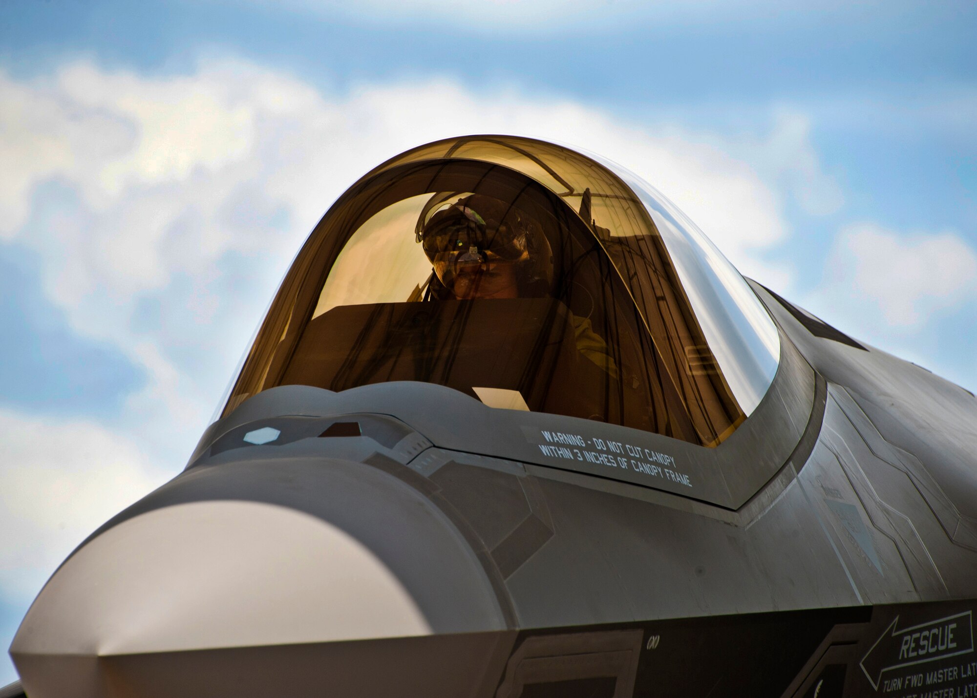 Marine Maj. Joseph Bachmann, of the 33rd Operations Group, executes aircraft shutdown procedures of the second F-35 Lightning II joint strike fighter to arrive at Eglin Air Force Base, Fla., July 20.  Bachmann is the first Marine pilot to be JSF certified.  Aircraft AF-8 is the flagship for the 58th Fighter Squadron.  (U.S. Air Force photo/Samuel King Jr.)