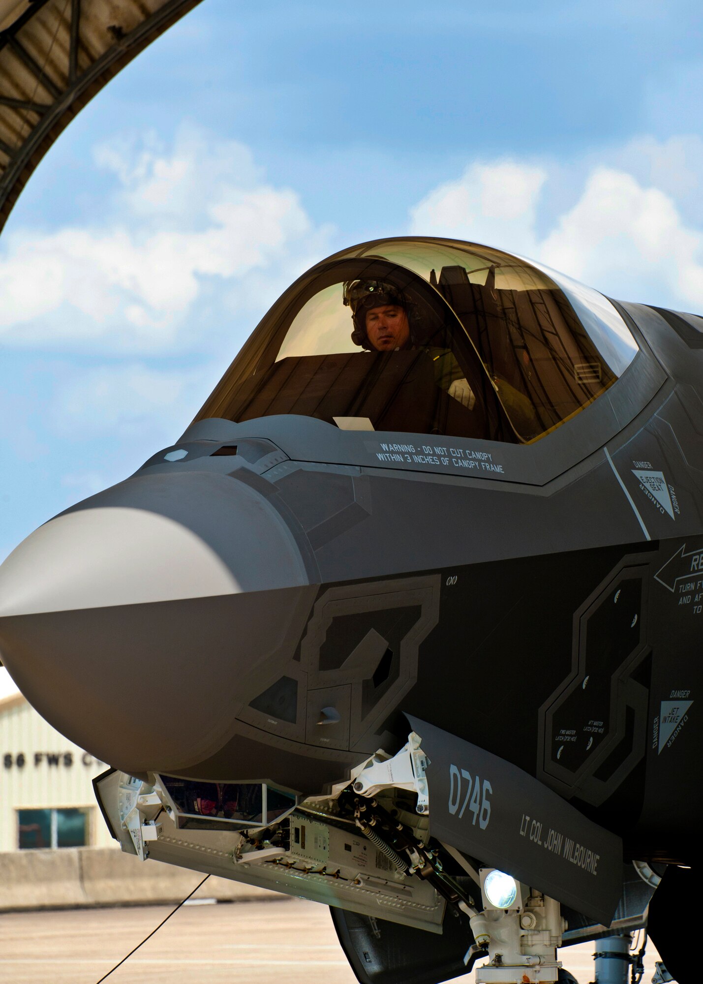 Marine Maj. Joseph Bachmann, of the 33rd Operations Group, executes shutdown procedures after bringing in the newest F-35 Lightning II joint strike fighter to its home at Eglin Air Force Base, Fla., July 20.  Bachmann is the first Marine pilot to be JSF certified and AF-8 is the second aircraft to arrive to the 33rd Fighter Wing.  (U.S. Air Force photo/Samuel King Jr.)