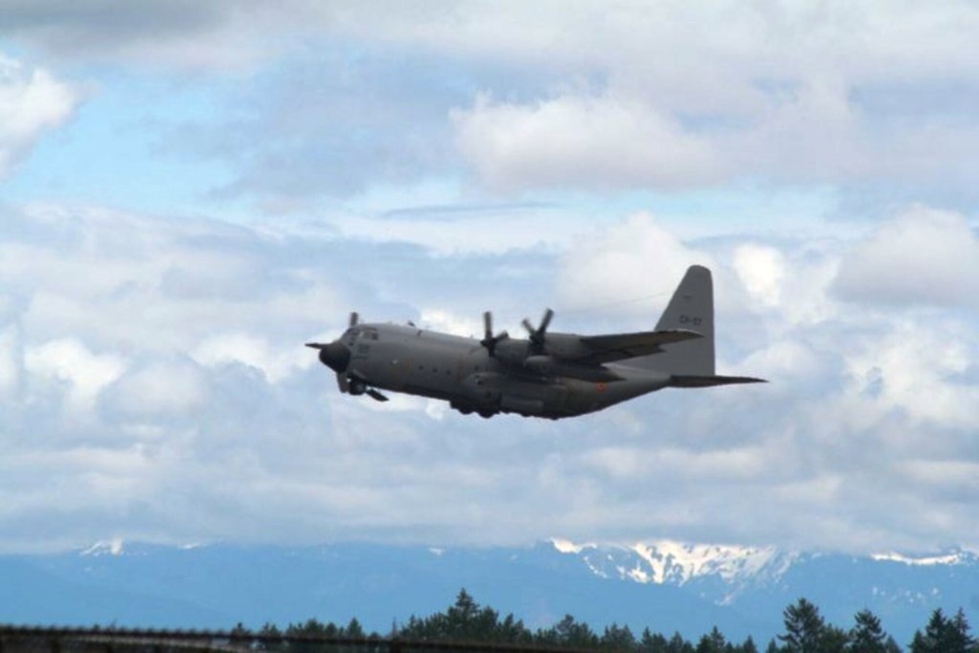 A Belgium air force C-130 takes off from McChord Field, Joint Base Lewis-McChord, Wash., on July 20, 2011, as part of preparations for Air Mobility Rodeo 2011. Rodeo, sponsored by the Air Mobility Command, is the Mobility Air Force's (MAF) readiness competition. This competition focuses on improving worldwide air mobility forces' professional core abilities. More than 150 teams and 3,000 people from the Air Force, and Air Force Reserve, as well as allied nations, participated in the 2011 competition. (U.S. Air Force Photo/Master Sgt. Scott T. Sturkol) 

