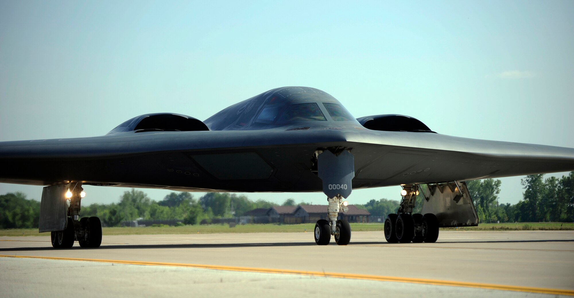 WHITEMAN AIR FORCE BASE, Mo. -- A B-2 Spirit taxis onto the flightline here July 14 officially ending a week long surge that tested Whiteman's ability to hot-pit refuel the B-2 while continuously generating sorties. The surge brought members of Active duty, Guard and Reserve together to ensure our nations nuclear deterrence was ready at a moment's notice. (U.S. Air Force photo by Airman 1st Class Cody H. Ramirez)