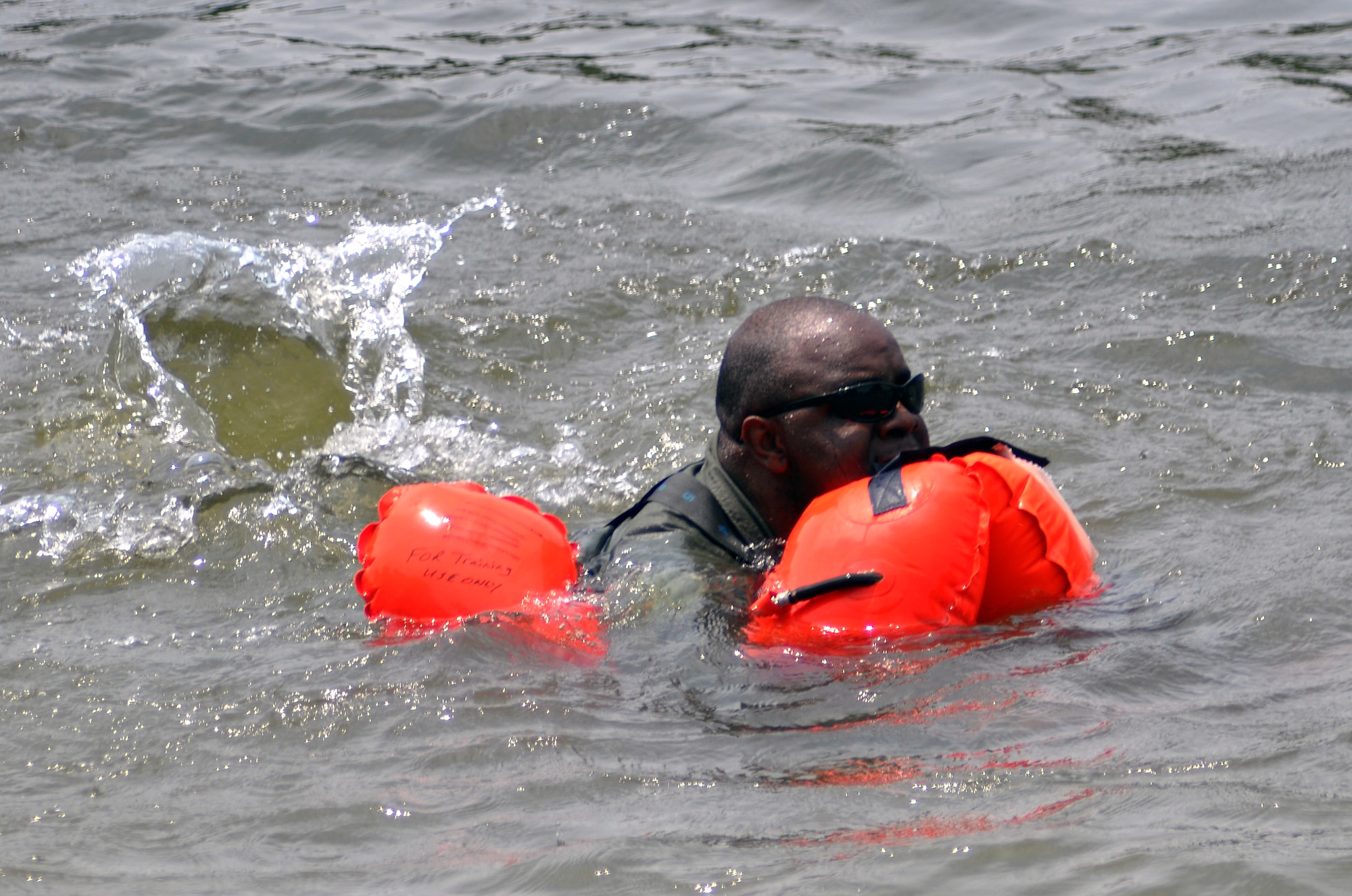 Master Sgt. Johnny Montgomery makes his way to shore during recent 908th Airlift Wing water survival training in the Alabama River.