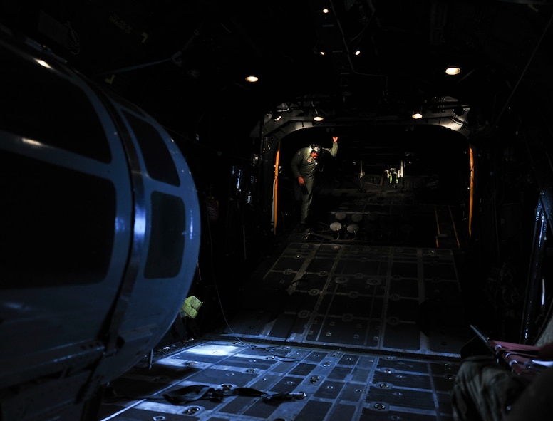 U.S. Air Force Tech. Sgt. Alfert Anderson, 71st Rescue Squadron loadmaster, checks and secures the cargo door of an HC-130 Combat King at Moody Air Force Base, Ga., July 12, 2011. A thorough inspection of the entire aircraft is completed before every flight to ensure crew safety. (U.S. Air Force photo by Senior Airman Stephanie Mancha/Released)