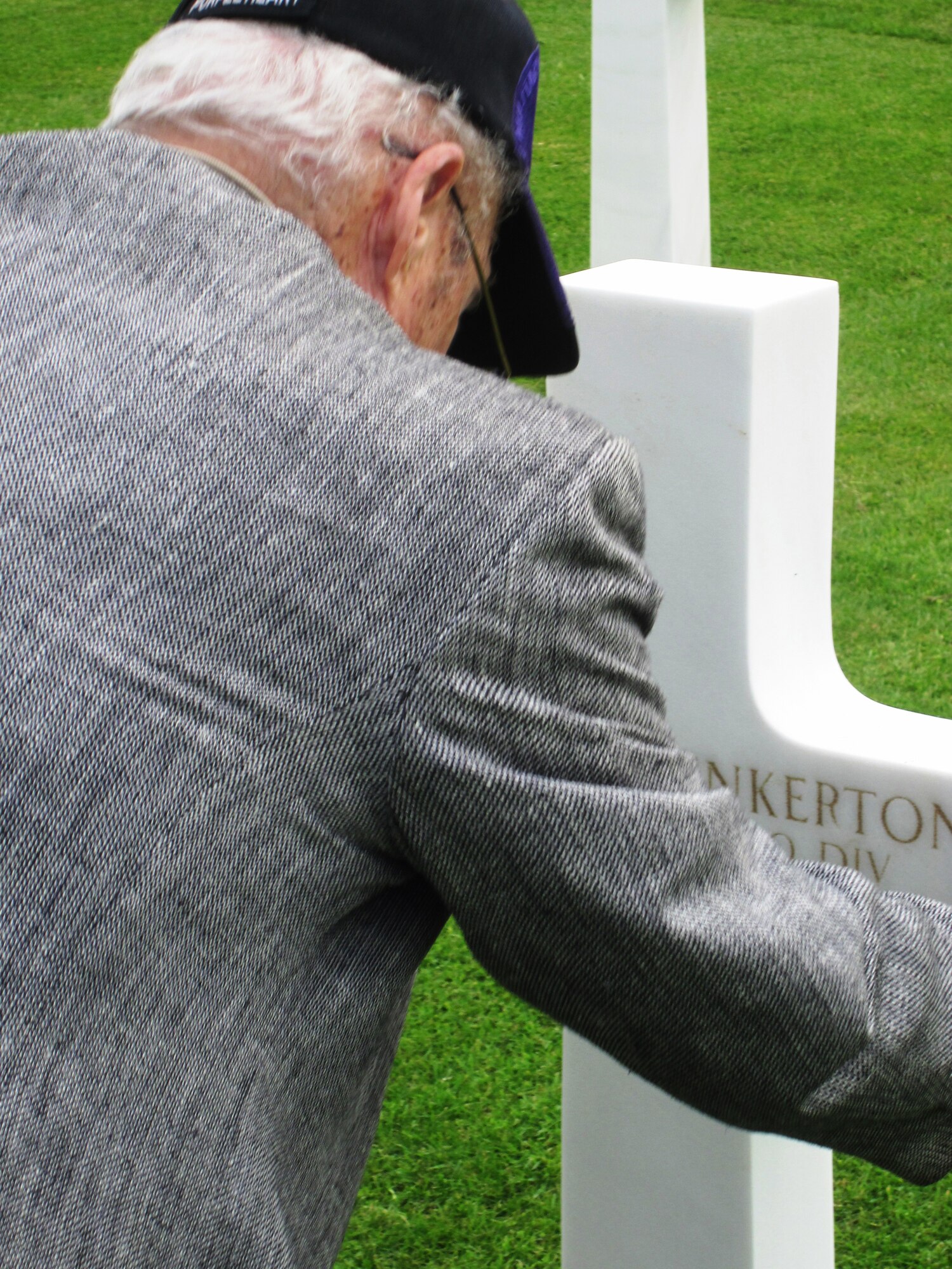 CAMBRIDGE AMERICAN CEMETERY, England - James Pinkerton, 87-year-old Purple Heart veteran of World War II, visits his brother’s grave at Cambridge American Cemetery, May 19, 2011. Pinkerton had not seen his brother in more than 50 years, since the two joined the Army during WWII and Pinkerton deployed to serve in the Pacific. His brother served in Europe and was laid to rest in Cambridge, England. (Courtesy photo)