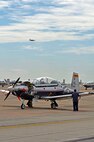 LAUGHLIN AIR FORCE BASE, Texas – Ralph Mersham Jr., T-6A Texan II aircraft maintainer, conducts inspections on a T-6A aircraft here July 20. The aircraft is a single-engine, two-seat primary training aircraft designed to train student pilots. (U.S. Air Force photo by Senior Airman Scott Saldukas)