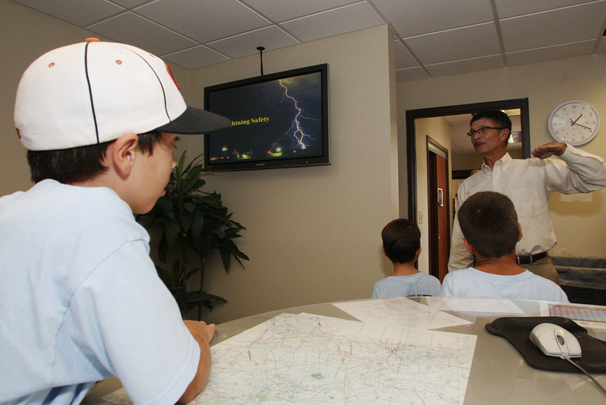 John Ridley, 94th Operations Group Weather Center, stresses the dangers of lightning during the base operations tour. (U.S. Air Force Photo/Don Peek)