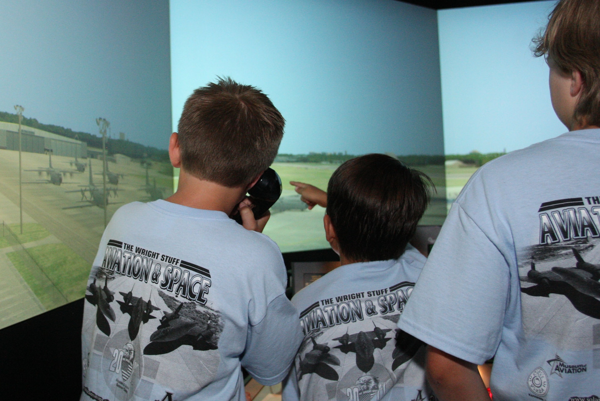 Students learn some of what controllers experience on the air traffic control simulator. (U.S. Air Force Photo/Don Peek)