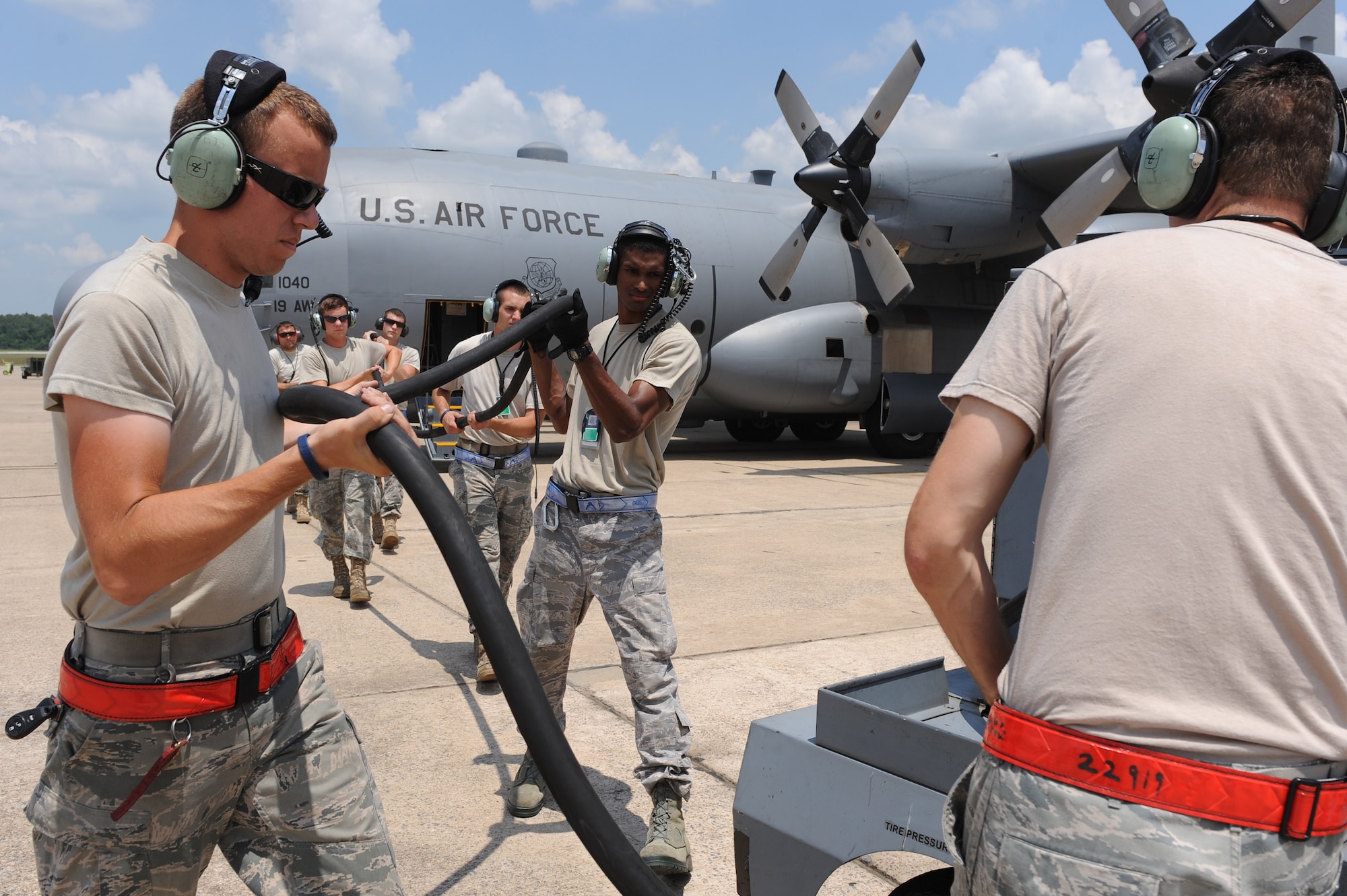 The 19th Aircraft Maintenance Squadron C-130H3 RODEO team works as a team to carry a power cable back to a -86 generator, July 15, 2011, at Little Rock Air Force Base, Ark.  The 19th AMS C-130H3 RODEO team is competing with DOD, as well as, allied nations to enhance air mobility operations and promote esprit de corps. (U.S. Air Force photo by Tech. Sgt. Chad Chisholm)
