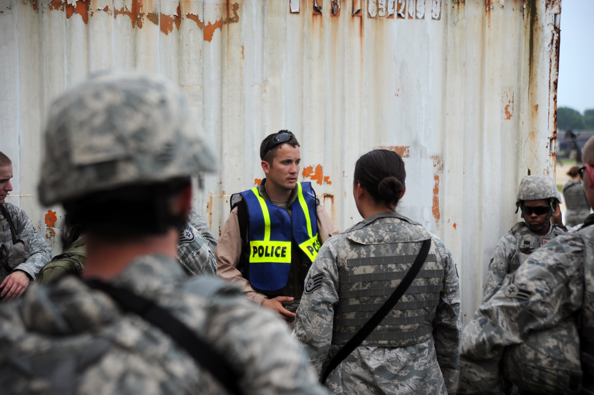 Staff Sergeant Joshua Jewel, 11th Security Forces Group trainer, briefs Defenders as to what they need to accomplish after exiting the CH-47 Chinook at the training site.  Members of the 11th Wing Security Forces Squadron and Combat Camera members of the 55th Signal Company performed simulated combat operations after being dropped from the Chinook at a remote location. (U.S. Air Force photo by Senior Airman Torey Griffith)