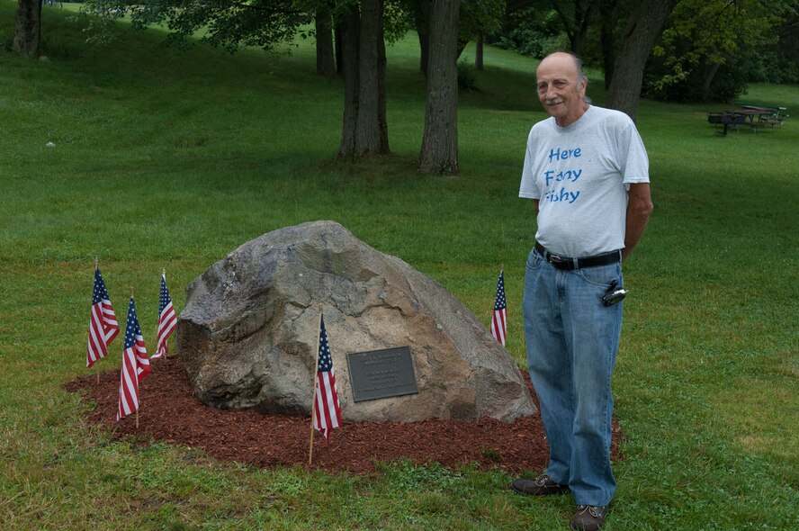 HANSCOM AIR FORCE BASE, Mass. - After more than 25 years, Joseph Ferrara visits the stone monument at Field 4, which was dedicated to his son, Airman 1st Class Joseph Ferrara Jr. Airman Ferrara was a member of the then-3245th Air Base Group Security Police Squadron and died while stationed in England on Jan. 20, 1985. While here, he coached Hanscom children involved in soccer, baseball and football leagues and was an avid participant in sports activities.  Field 4 was dedicated in his memory on May 31, 1985.  The plaque on the stone reads, “Joseph W. Ferrara Jr. Memorial Field with love from his family, friends and the 3245th SPS.” (U.S. Air Force photo by Rick Berry)