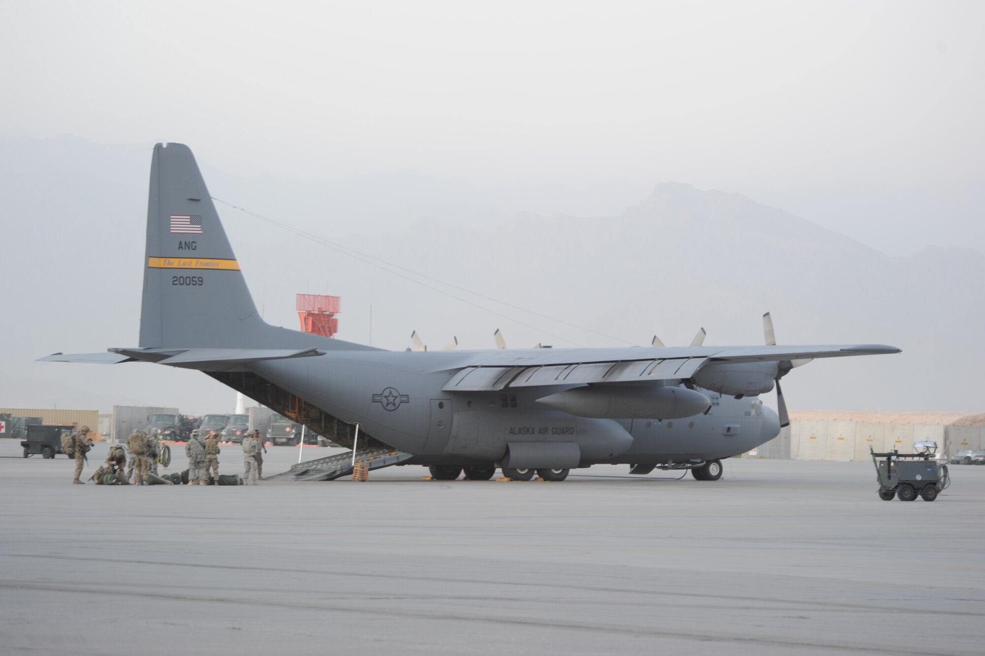 Engineers from the 172nd Infantry Brigade, Task Force Blackhawk, prepare to board a C-130 Hercules aircraft here from the 774th Expeditionary Airlift Squadron on their way to Forward Operating Base Sharana, Afghanistan July 19, 2011.  C-130s perform a variety of missions here including strategic airlift, aeromedical evacuation and personnel transport. (U.S. Air Force photo/Capt. Korry Leverett)