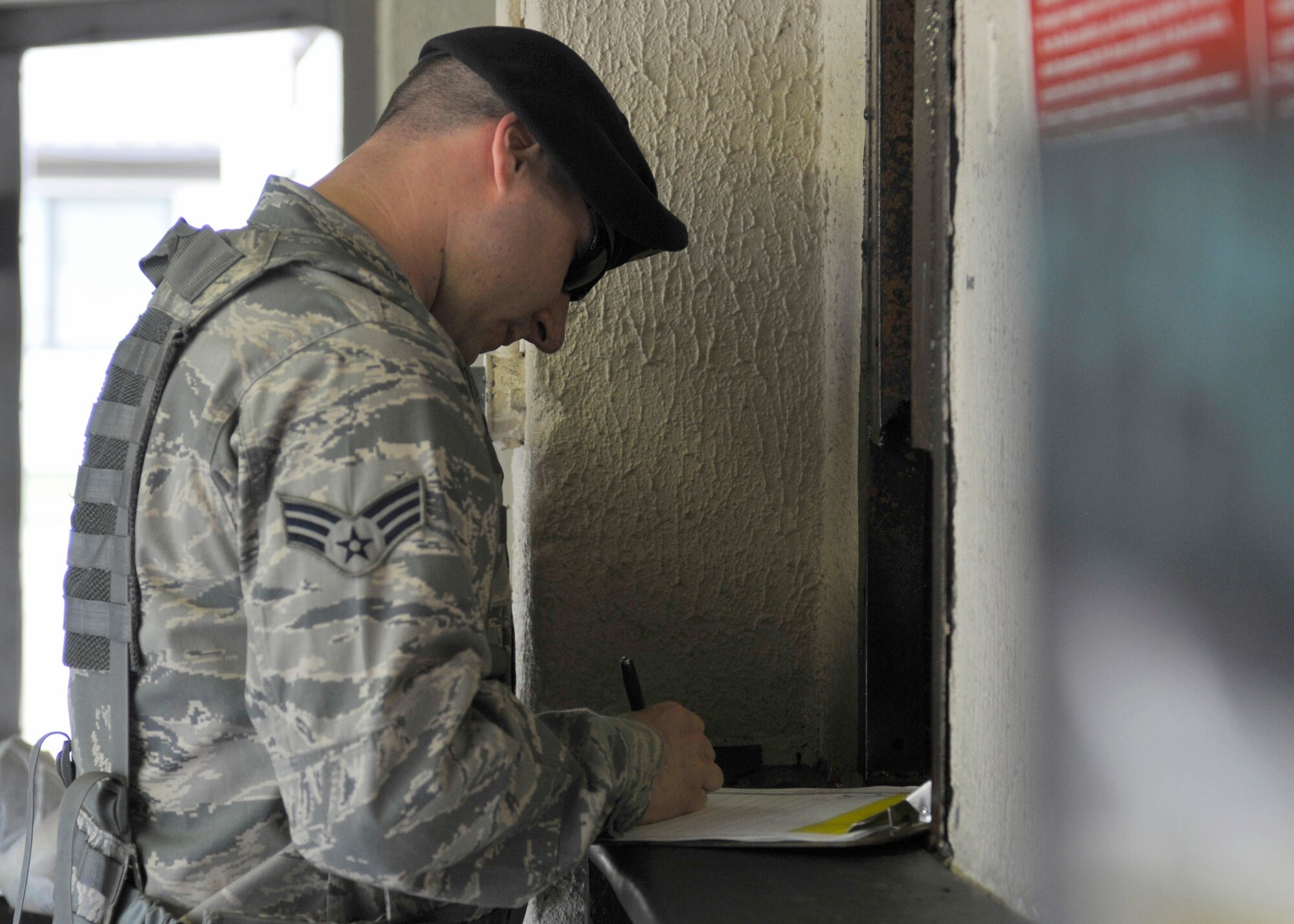 ROYAL AIR FORCE LAKENHEATH, England - Senior Airman Sean Gallant, 48th Security Forces Squadron patrolman, signs paperwork prior to receiving his weapon at the Armory, July 12, 2011. Armorers are responsible for the distribution of weapons to 48th SFS Airmen on patrol as well as deployers. The 48th SFS is the highest deployed SFS in United States Air Forces in Europe.. (U.S. Air Force photo/Senior Airman Tiffany M. Deuel)