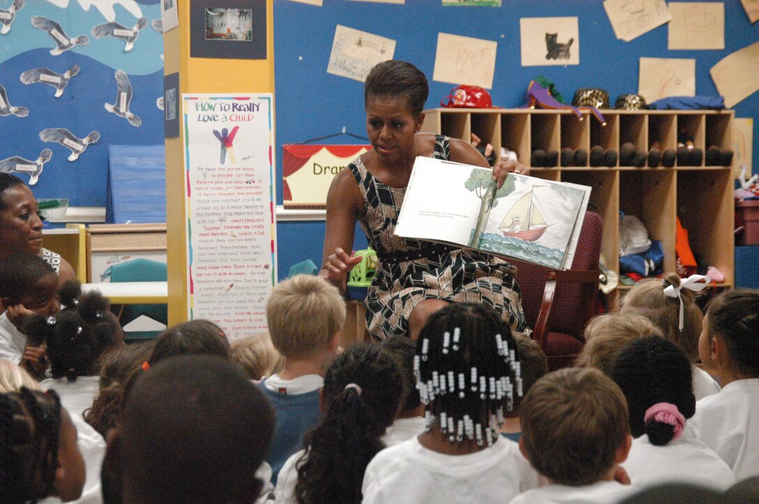 First lady Michelle Obama reads to 5 and 6-year-olds at the Naval Air Station Oceana Child and Youth Programs summer camp in Virginia Beach, Va, July 21, 2011. Obama visited classrooms and met with children before speaking at the base theather before the on-base premiere of the latest Harry Potter movie, "Harry Potter and the Deathly Hollows: Part 2." U.S. Navy photo by Petty Officer 2nd Class Terah L. Mollise