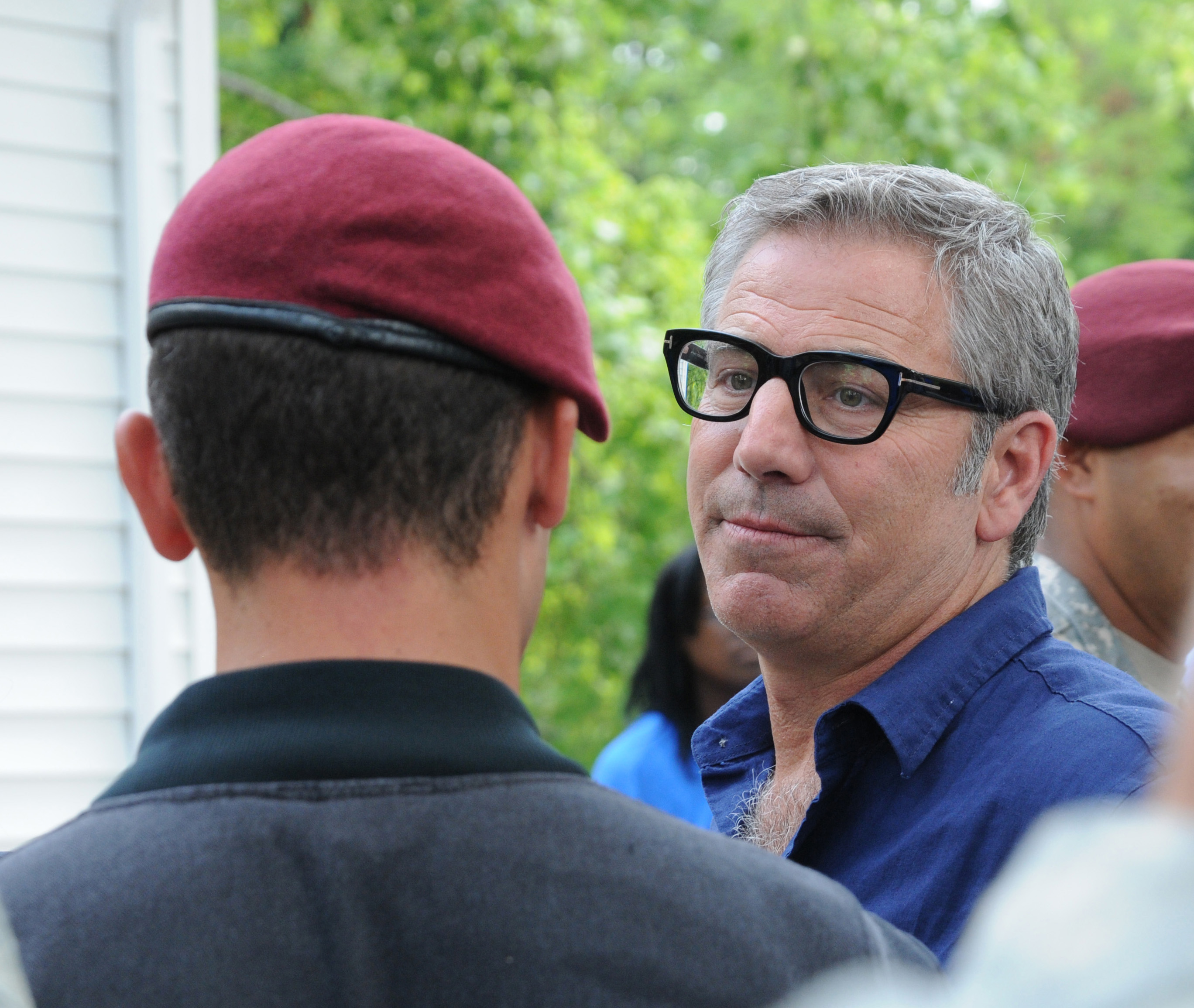 Extreme Makeover Home Edition cast member Paul DiMeo speaks with a Fort Bragg parachute