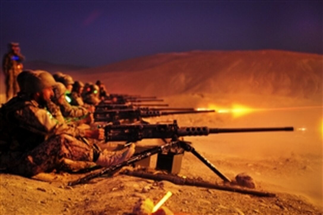 Afghan National Army recruits fire the .50 caliber heavy machine gun during a night exercise held at the Infantry Branch School on Camp Julien in Kabul, Afghanistan, July 19, 2011. The exercise is the last live heavy weapons fire before the Afghan soldiers graduate from bootcamp.