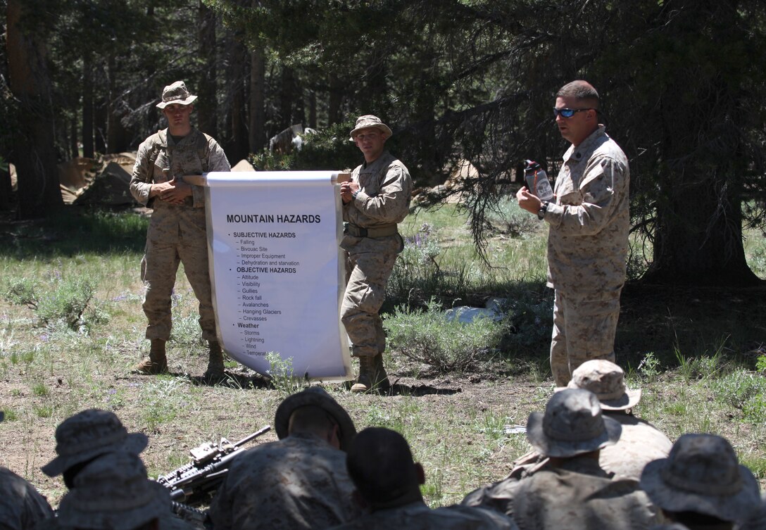 Staff Sgt. Gregory J. Hoover, an instructor at the MWTC, teaches Marines about mountain safety, July 21. As result of the extremities faced by the Marines as they transition from a desert to mountainous environment, they are going through two days of pre-environmental training, where they will learn the fundamentals in mountain warfare and survival.