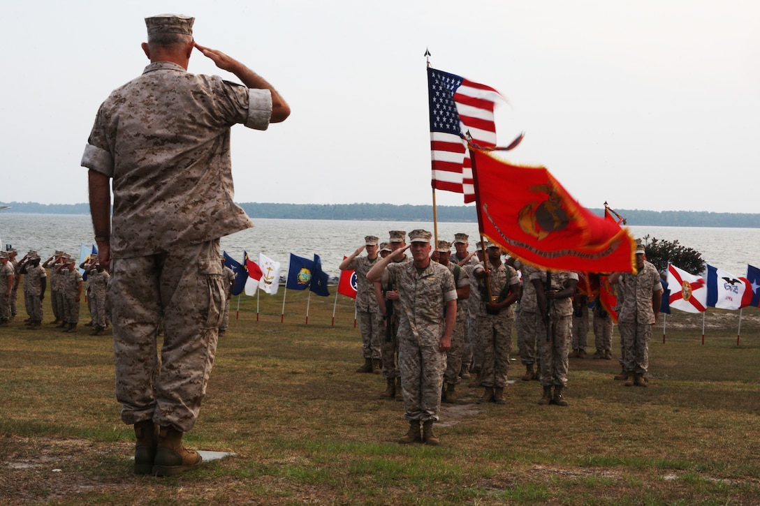 Lt. Gen. Dennis J. Hejlik, commanding general of Fleet Marine Forces Atlantic; Marine Corps Bases Atlantic and United States Marine Corps Forces Command (left), salutes Maj. Gen. Carl B. Jensen, commanding general of Marine Corps Installations East, during the MCIEAST change of command ceremony at the 2nd Marine Logistics Group Amphitheater, July 22. Jensen, who has served 36 years in the Marine Corps, relinquishes command of MCIEAST to Col. Thomas A. Gorry, brigadier general select, previously of the Command and Staff College, Marine Corps University.