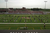 Drill instructors and Marines with Recruiting Station Twin Cities lead more than 130 athletes in warm-up exercises at Maple Grove Senior High School during the Minneapolis Junior Rank Diamond Flight Football Camp July 22. For additional imagery from the event, visit www.facebook.com/rstwincities.