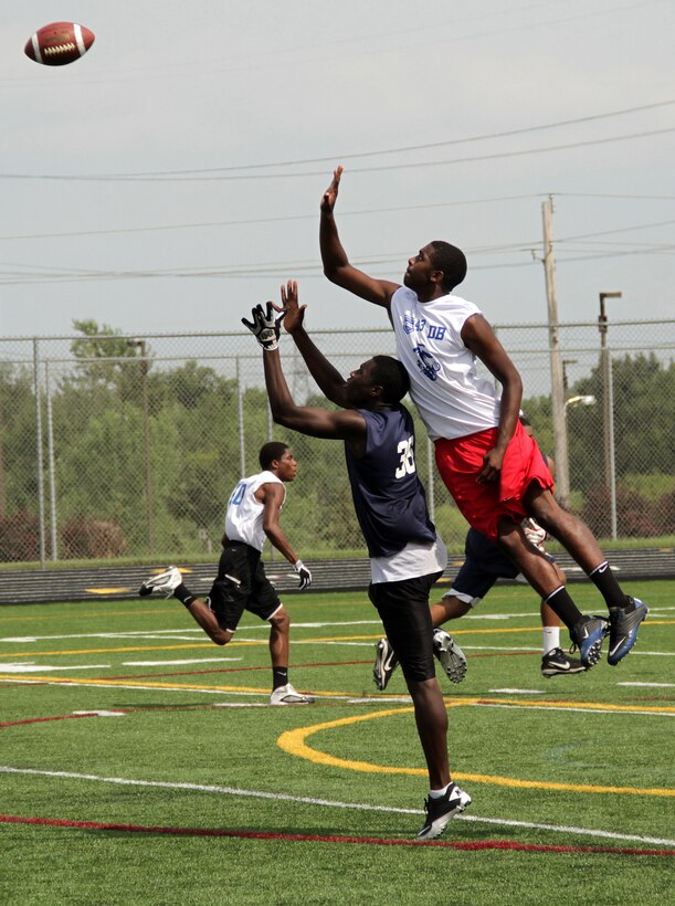 A defensive back prepares to block a pass unbeknownst to a wide receiver during one-on-one drills at the Minneapolis Junior Rank Diamond Flight Football Camp July 22. The three-day camp was held at Maple Grove Senior High School. For additional imagery from the event, visit www.facebook.com/rstwincities.