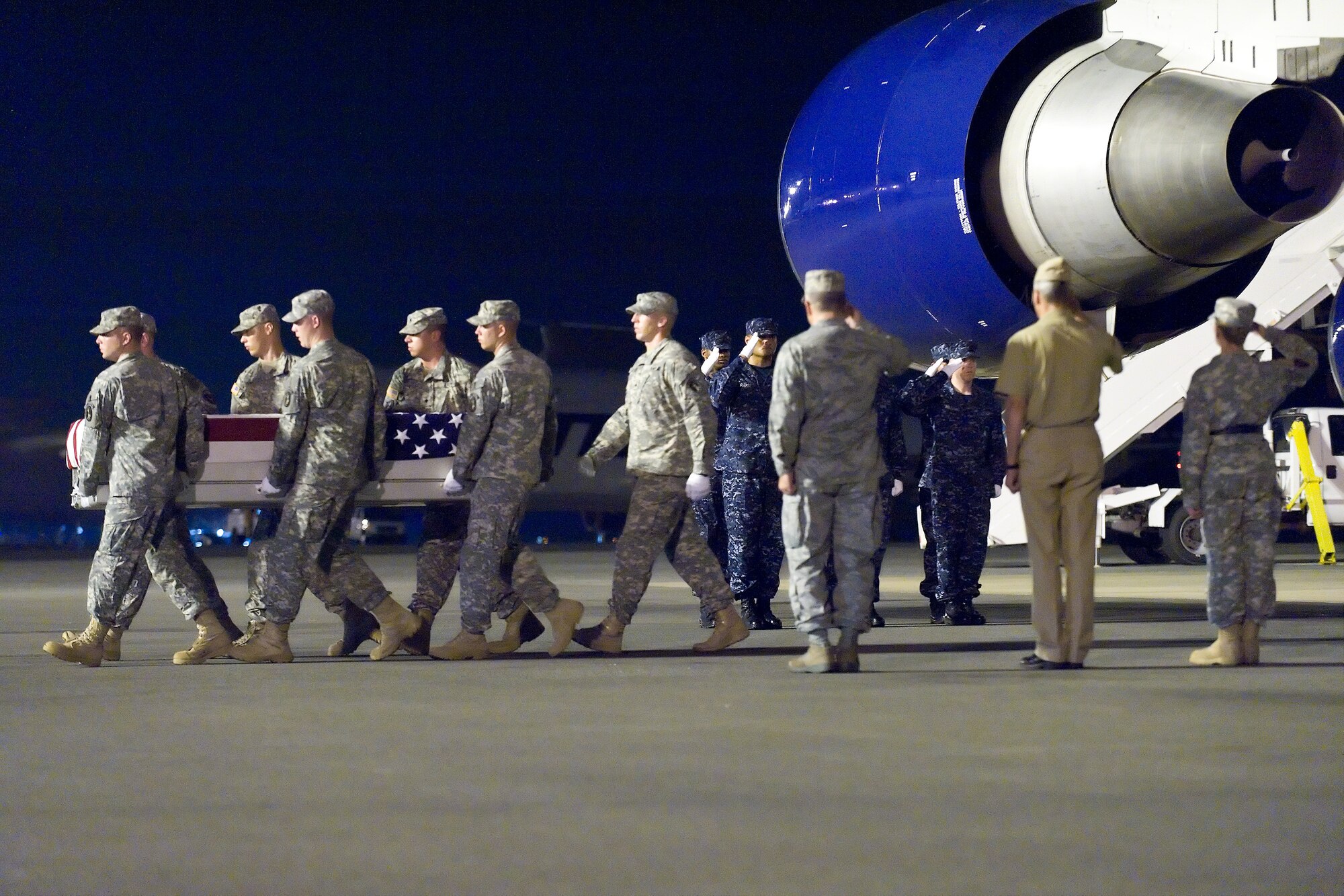 A U.S. Army carry team transfers the remains of Army Sgt. Jacob Molina, of Houston, Texas, at Dover Air Force Base, Del., July 22, 2011.  Molina was assigned to 2nd Battalion, 27th Infantry Regiment, 3rd Brigade Combat Team, 25th Infantry Division, Schofield Barracks, Hawaii. (U.S. Air Force photo/Roland Balik)