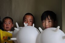Delgerkhaan, Mongolia – Three Mongolian young boys show off the balloons they received while visiting the two-day multinational mobile clinic in Delgerkhaan, Mongolia on July 20 in support of Pacific Angel-Mongolia, a 13th Air Force led combined humanitarian assistance operation. U.S. Soldiers, Sailors and Airmen worked together with Mongolian Armed Forces, Sri Lankan Forces and National Government Organization Project Hope in providing healthcare in Delgerkhaan for two days. Their team moves to a new location every two days to spread out their coverage in the area, while a stationary team works out of a hospital in Ondorkhan, Mongolia.  This is the fourth year of Pacific Angel, but the first time the operation has been hosted in Mongolia. The operation helps cultivate common bonds and foster goodwill between the United States, Mongolia and other regional nations. In addition to veterinary training, a clinic is being refurbished and medical outreach events are being held in Ondorkhan, Delgerkhaan and Tsenkhermandal soums of the Hentii province from July 18-23.  (U.S. Air Force photo/Master Sgt. Cohen A. Young)


