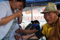 Delgerkhaan, Mongolia – A Mongolian man has his blood pressure checked during registration procedures at the two-day mobile clinic in Delgerkhaan, Mongolia on July 20 in support of Pacific Angel-Mongolia, a 13th Air Force led combined humanitarian assistance operation. U.S. Soldiers, Sailors and Airmen worked together with Mongolian Armed Forces, Sri Lankan Forces and National Government Organization Project Hope in providing healthcare in Delgerkhaan for two days. Their team moves to a new location every two days to spread out their coverage in the area, while a stationary team works out of a hospital in Ondorkhan, Mongolia. This is the fourth year of Pacific Angel, but the first time the operation has been hosted in Mongolia. The operation helps cultivate common bonds and foster goodwill between the United States, Mongolia and other regional nations. In addition to veterinary training, a clinic is being refurbished and medical outreach events are being held in Ondorkhan, Delgerkhaan and Tsenkhermandal soums of the Hentii province from July 18-23.  (U.S. Air Force photo/Master Sgt. Cohen A. Young)
