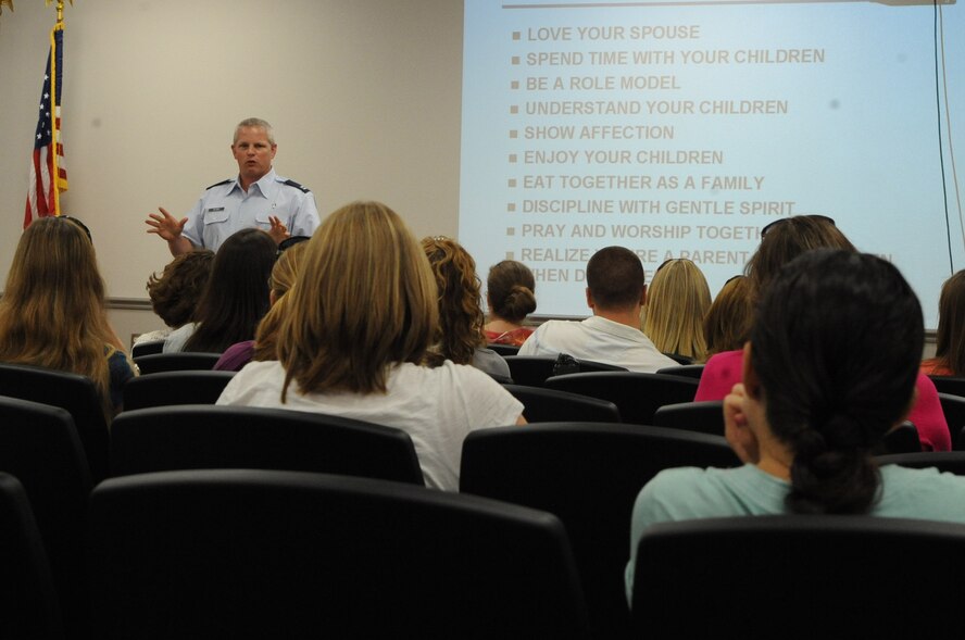 Chaplain (Capt.) Richard Holmes, a member of the 2nd Bomb Wing Chaplain Corps, gives a briefing to deploying military members and their spouses on Barksdale Air Force Base, La., July 18. The chapel provides briefings for Airmen and their spouses to give them the tools they need for handling the deployed lifestyle. (U.S. Air Force photo/Airman 1st Class Micaiah Anthony)(RELEASED)