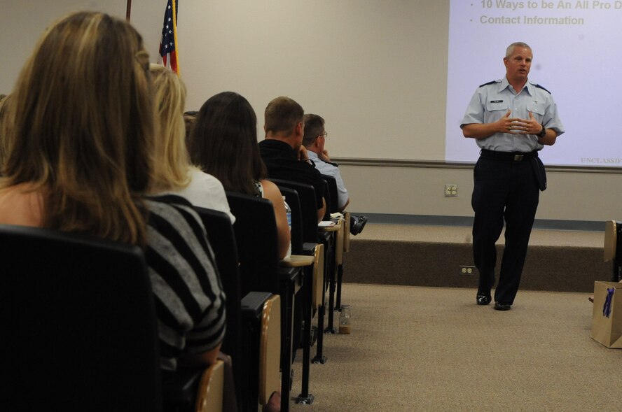 Chaplain (Capt.) Richard Holmes, a member of the 2nd Bomb Wing Chaplain Corps, gives a briefing to military members and their spouses on Barksdale Air Force Base, La., July 18. The chapel provides briefings for Airmen and their spouses to give them the tools they need for handling the deployed lifestyle. (U.S. Air Force photo/Airman 1st Class Micaiah Anthony)(RELEASED)